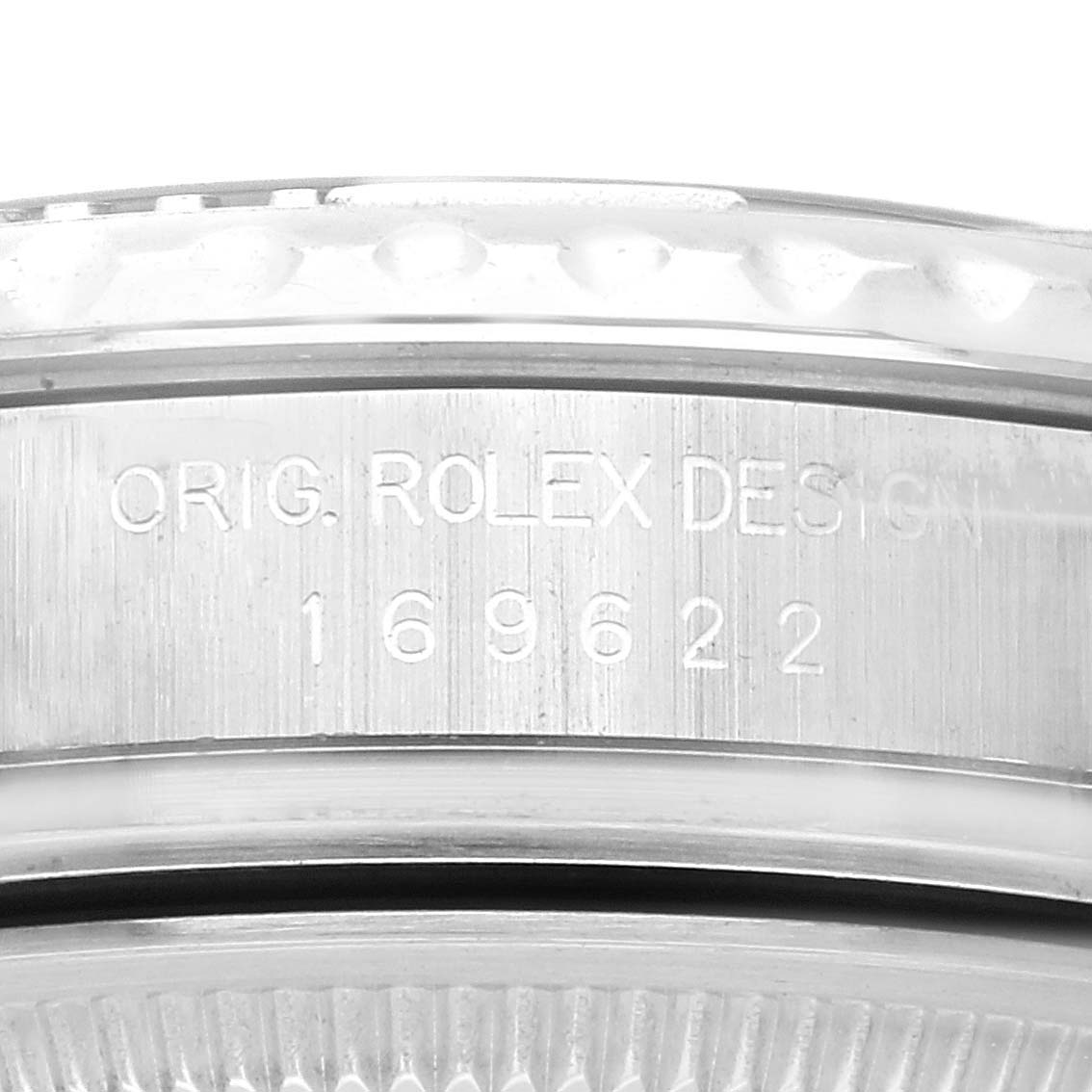 The image shows a close-up of the bezel and engraved serial number of a Rolex Yacht-Master 169622 Women's Stainless Steel Grey Dial 169622 Women's Stainless Steel Grey Dial watch.