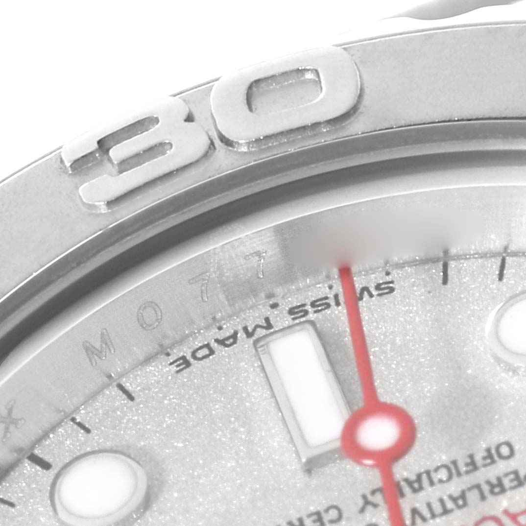 The image shows a close-up of a Rolex Yacht-Master 169622 Women's Stainless Steel Grey Dial 169622 Women's Stainless Steel Grey Dial watch bezel and part of the dial and red second hand.
