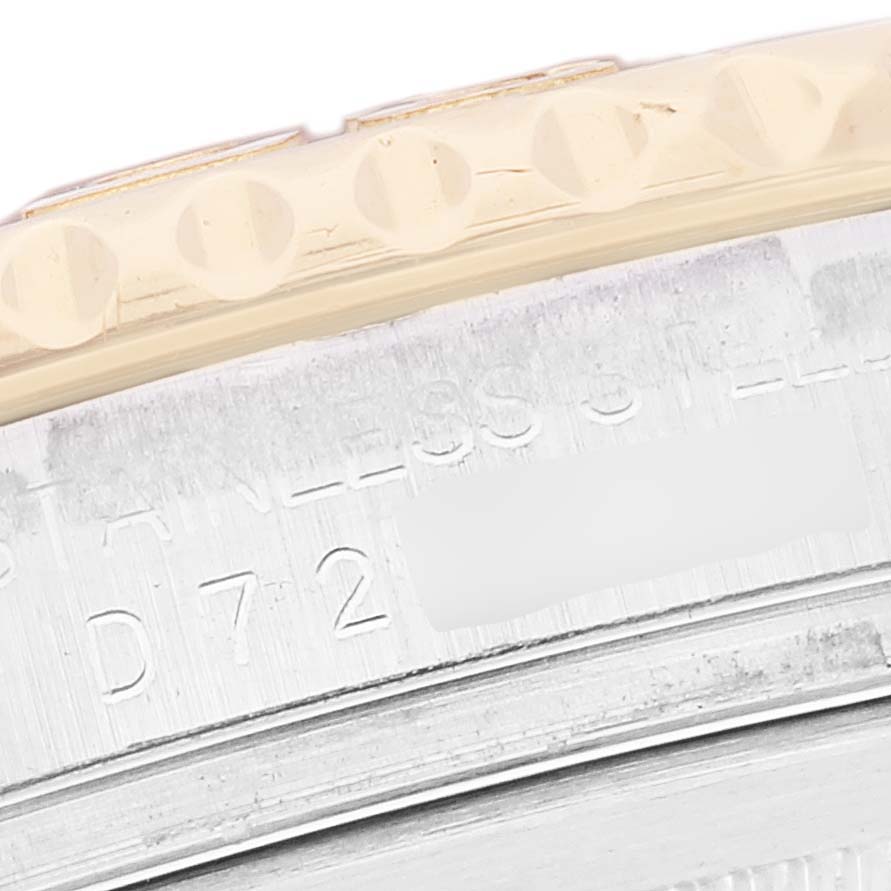 The image shows a close-up of the bezel and case sides of a Rolex Yacht-Master 16623 Men
s Steel and Gold (two tone) Blue Dial 16623 Men
s Steel and Gold (two tone) Blue Dial watch, focusing on the engraved model details.