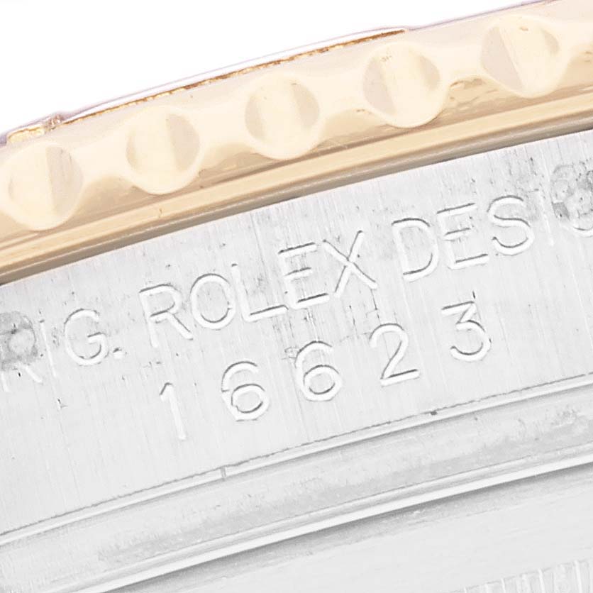 This image shows a close-up of the serial number and bezel of a Rolex Yacht-Master 16623 Men
s Steel and Gold (two tone) Blue Dial 16623 Men
s Steel and Gold (two tone) Blue Dial watch.