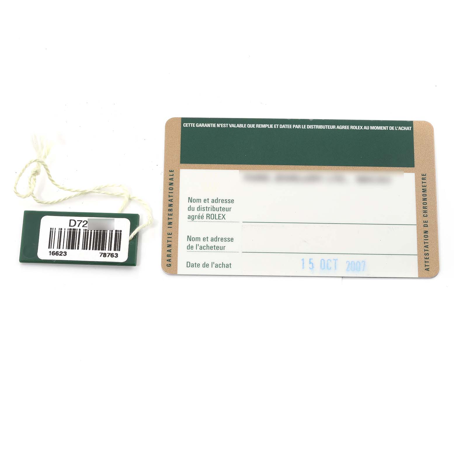 The image shows the warranty card and tag for the Rolex Yacht-Master 16623 Men
s Steel and Gold (two tone) Blue Dial 16623 Men
s Steel and Gold (two tone) Blue Dial watch.