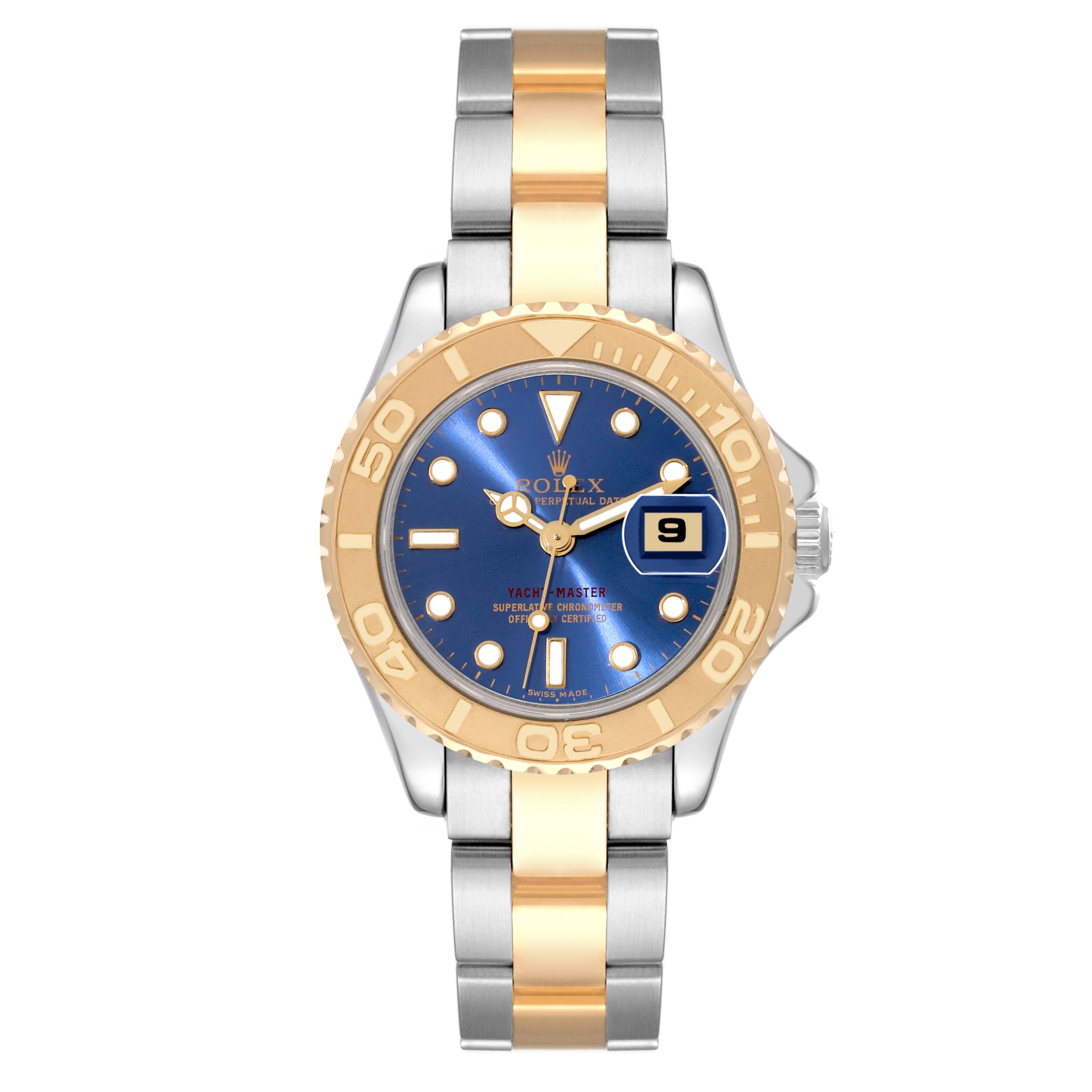 The image shows a front view of a Rolex Yacht-Master 69623 Women's Steel and Gold (two tone) Blue Dial 69623 Women's Steel and Gold (two tone) Blue Dial watch with a blue dial, gold bezel, and two-tone metal bracelet.