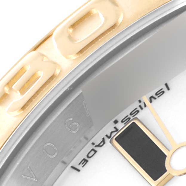 Close-up of the bezel, partial dial, and minute hand of the Rolex Yacht-Master 16623 Men's Steel and Gold (two tone) White Dial 16623 Men's Steel and Gold (two tone) White Dial watch.