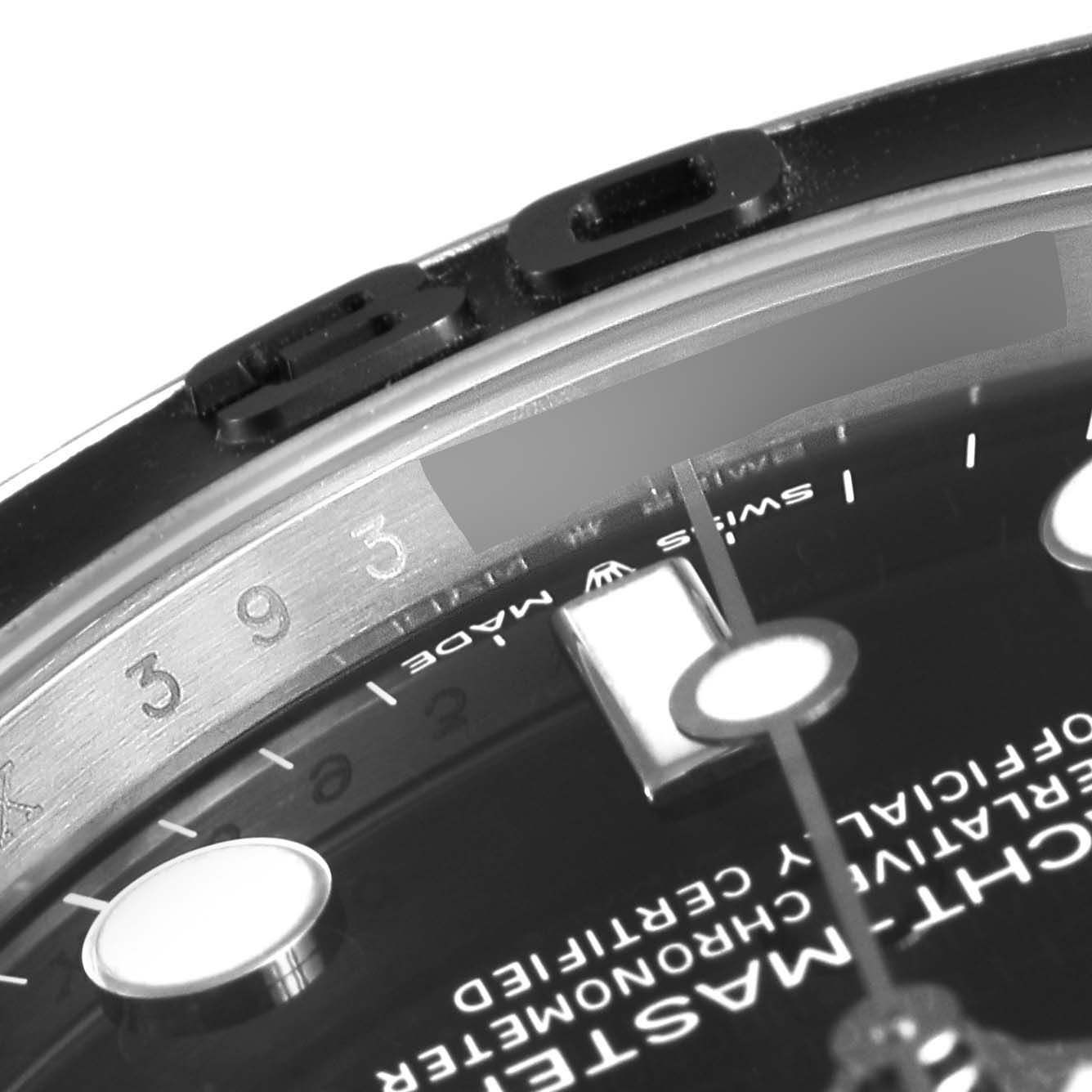 The close-up angle shows the bezel, part of the face, hands, and markers of the Yacht-Master model by Rolex.