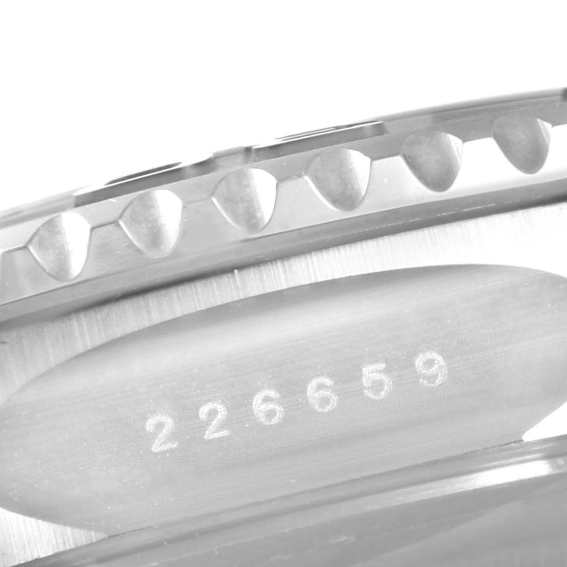 This close-up image shows the numbered side and bezel teeth of a Rolex Yacht-Master 226659 Men's White Gold Black Dial 226659 Men's White Gold Black Dial watch.