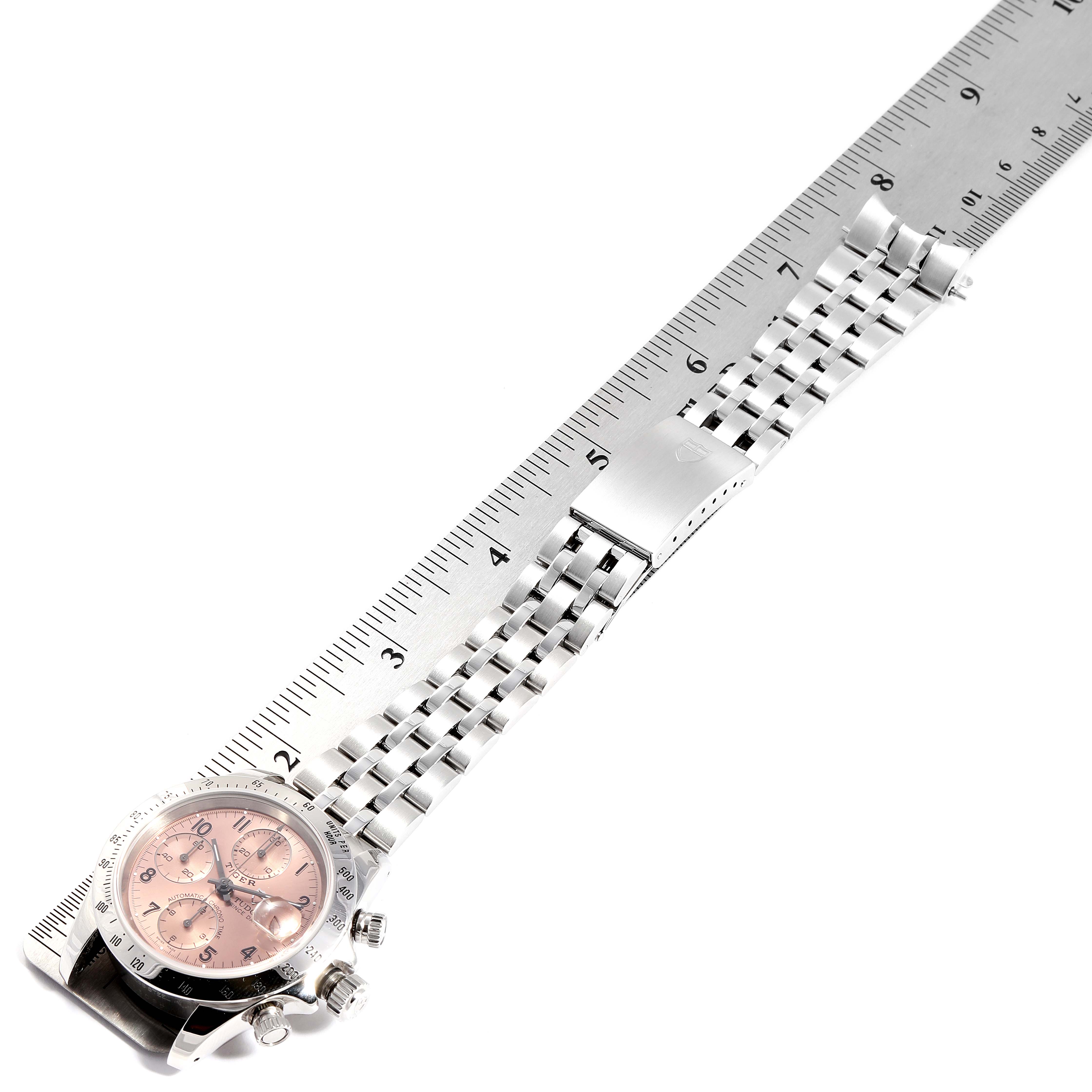 The image shows a Tudor Prince 79280 Men's Stainless Steel Pink Dial 79280 Men's Stainless Steel Pink Dial watch laying flat, showcasing the face, bezel, and metal bracelet beside a ruler.