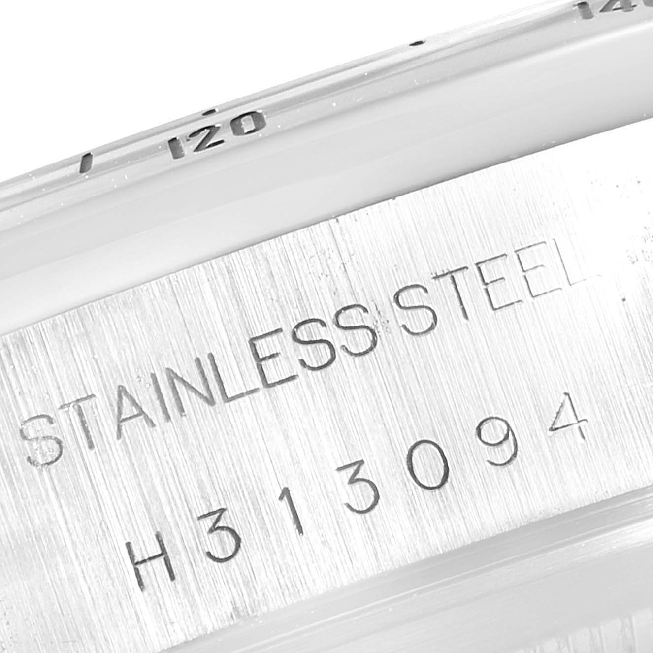 The image shows a close-up of the stainless steel back of a Tudor Prince 79280 Men's Stainless Steel Pink Dial 79280 Men's Stainless Steel Pink Dial model watch, displaying the serial number and part of the bezel.