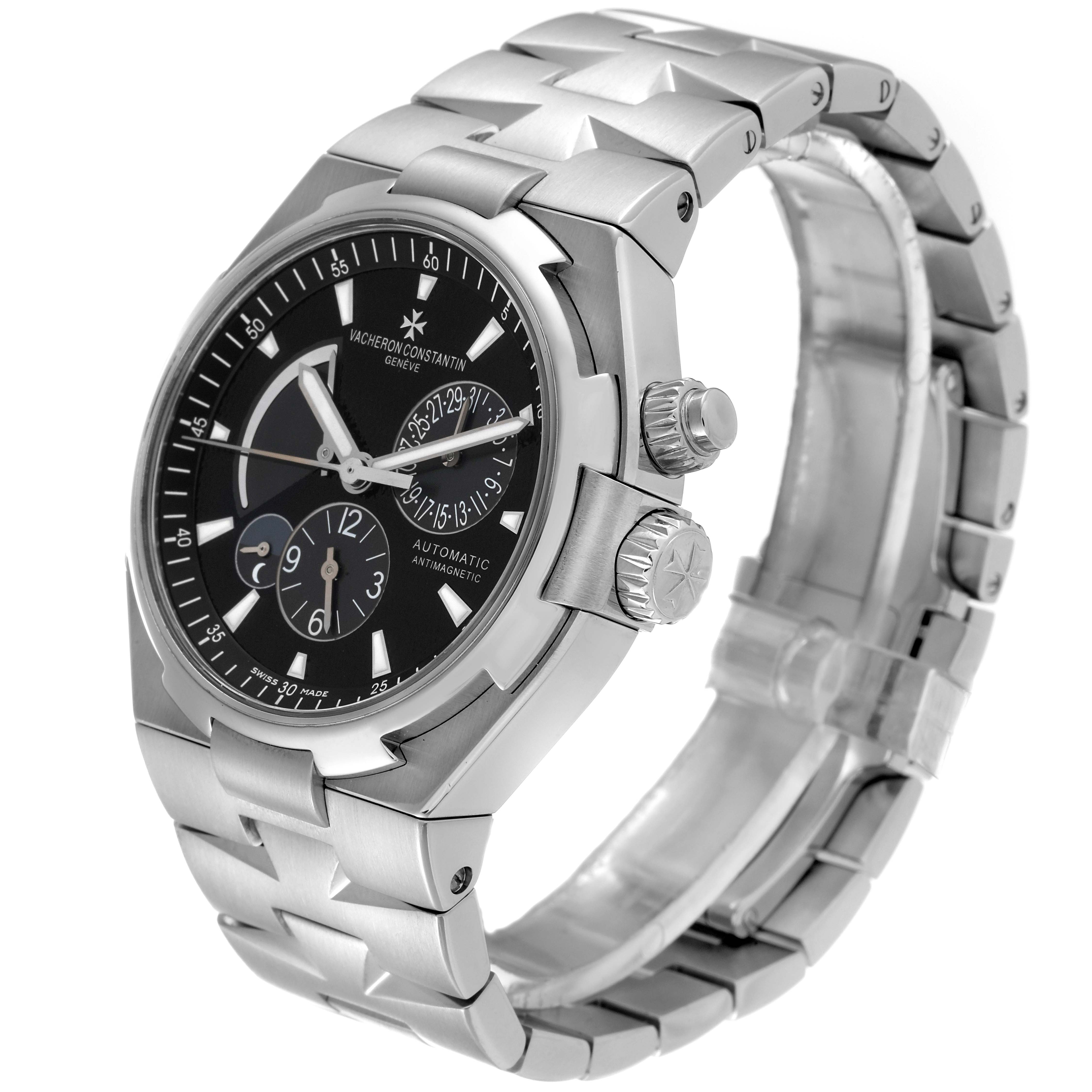 The image shows a Vacheron Constantin Overseas 47450/B01A-9227 Men
s Stainless Steel Black Dial 47450/B01A-9227 Men
s Stainless Steel Black Dial watch at a three-quarter angle, highlighting the dial, bezel, crown, and bracelet.