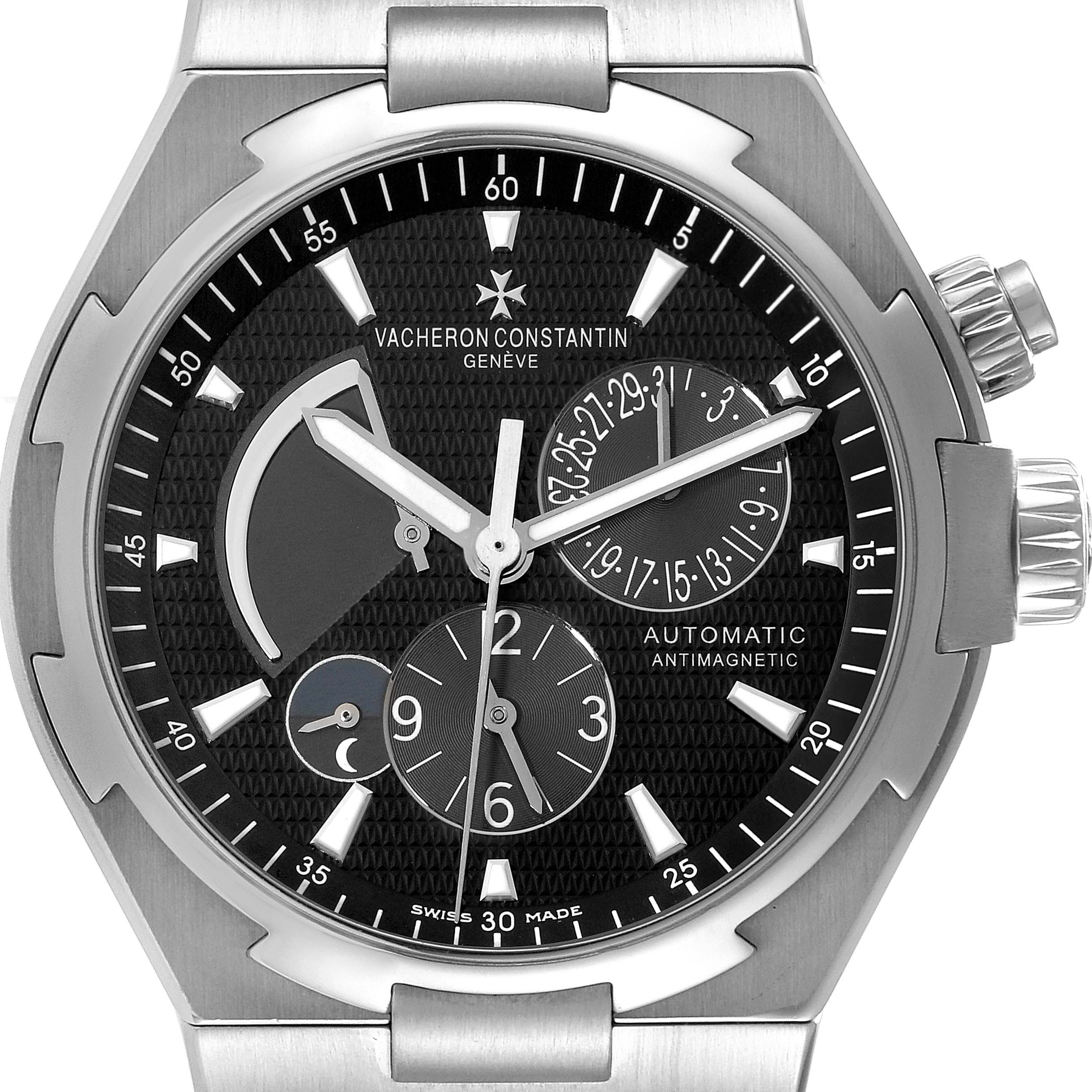 The image shows a front view of the Vacheron Constantin Overseas 47450/B01A-9227 Men
s Stainless Steel Black Dial 47450/B01A-9227 Men
s Stainless Steel Black Dial model watch, highlighting the dial and complications.