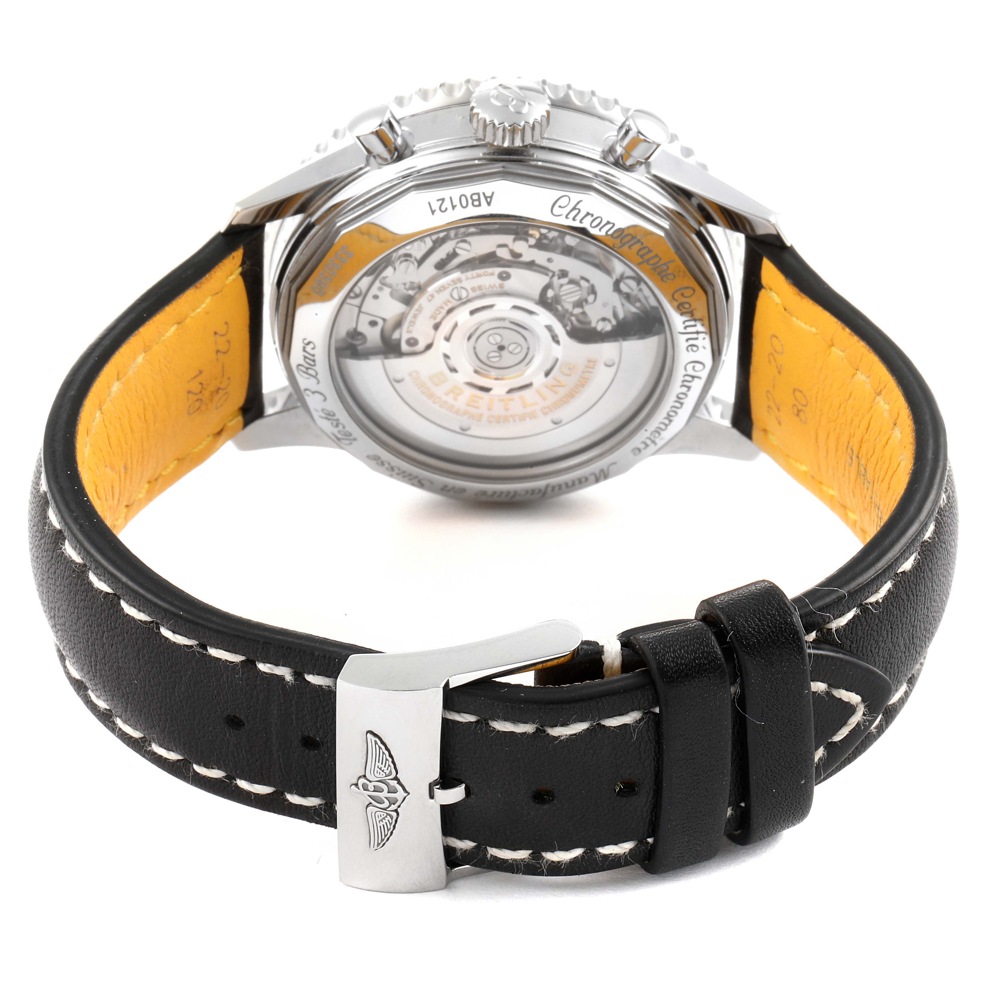 This Navitimer model by Breitling is shown from the back, featuring its movement and black leather strap with a clasp.
