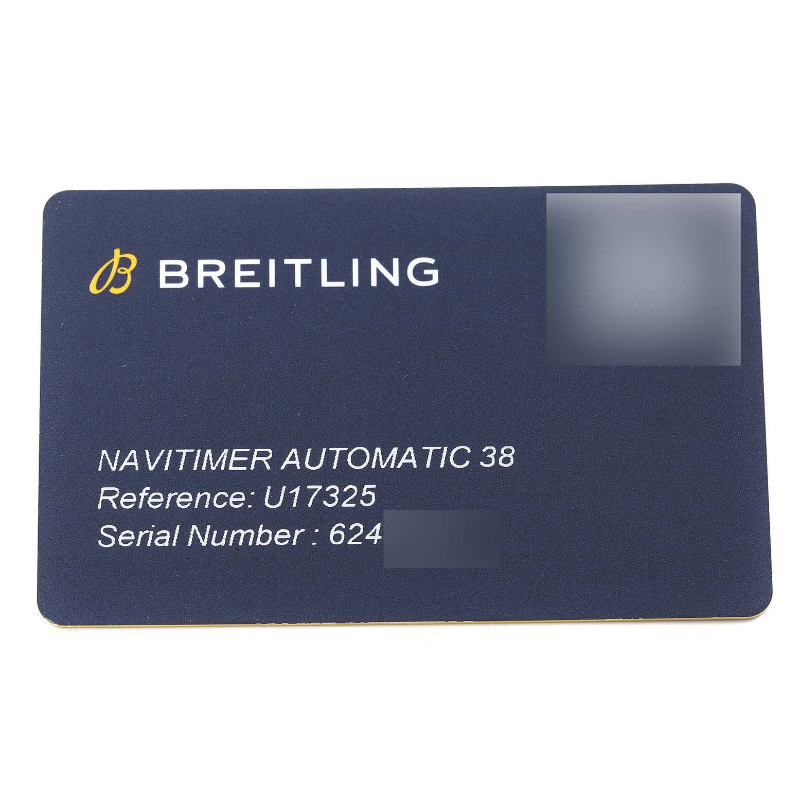 This image shows a warranty card for the Breitling Navitimer U17325 Men
s Stainless Steel Silver Dial U17325 Men
s Stainless Steel Silver Dial Automatic 38 watch, displaying the model, reference, and serial number.