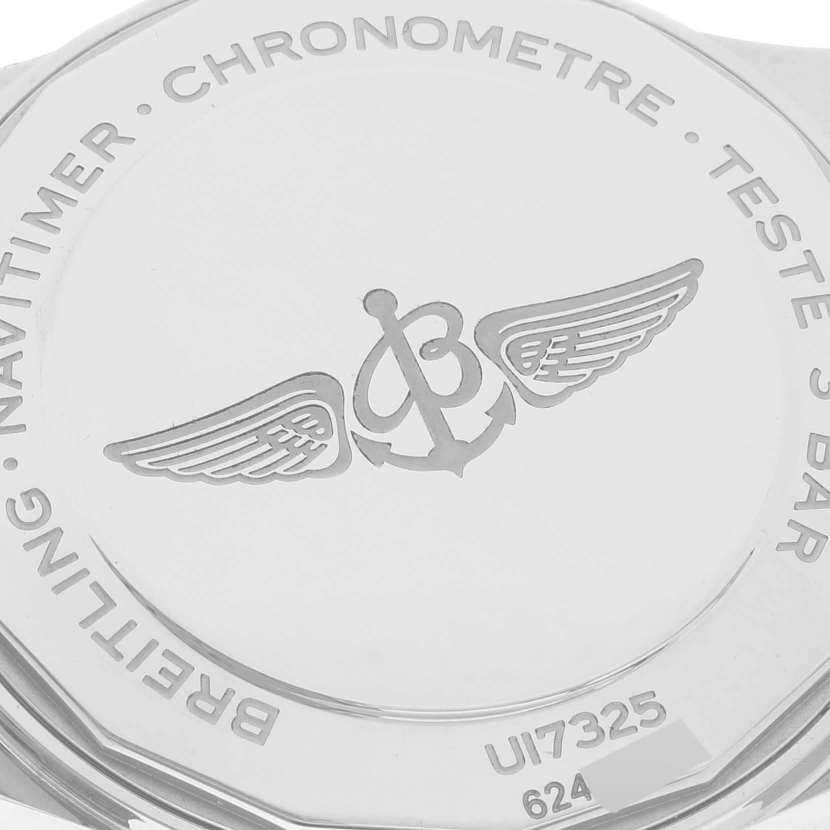 The image shows the back case of a Breitling Navitimer U17325 Men
s Stainless Steel Silver Dial U17325 Men
s Stainless Steel Silver Dial watch viewed from a top-down angle.