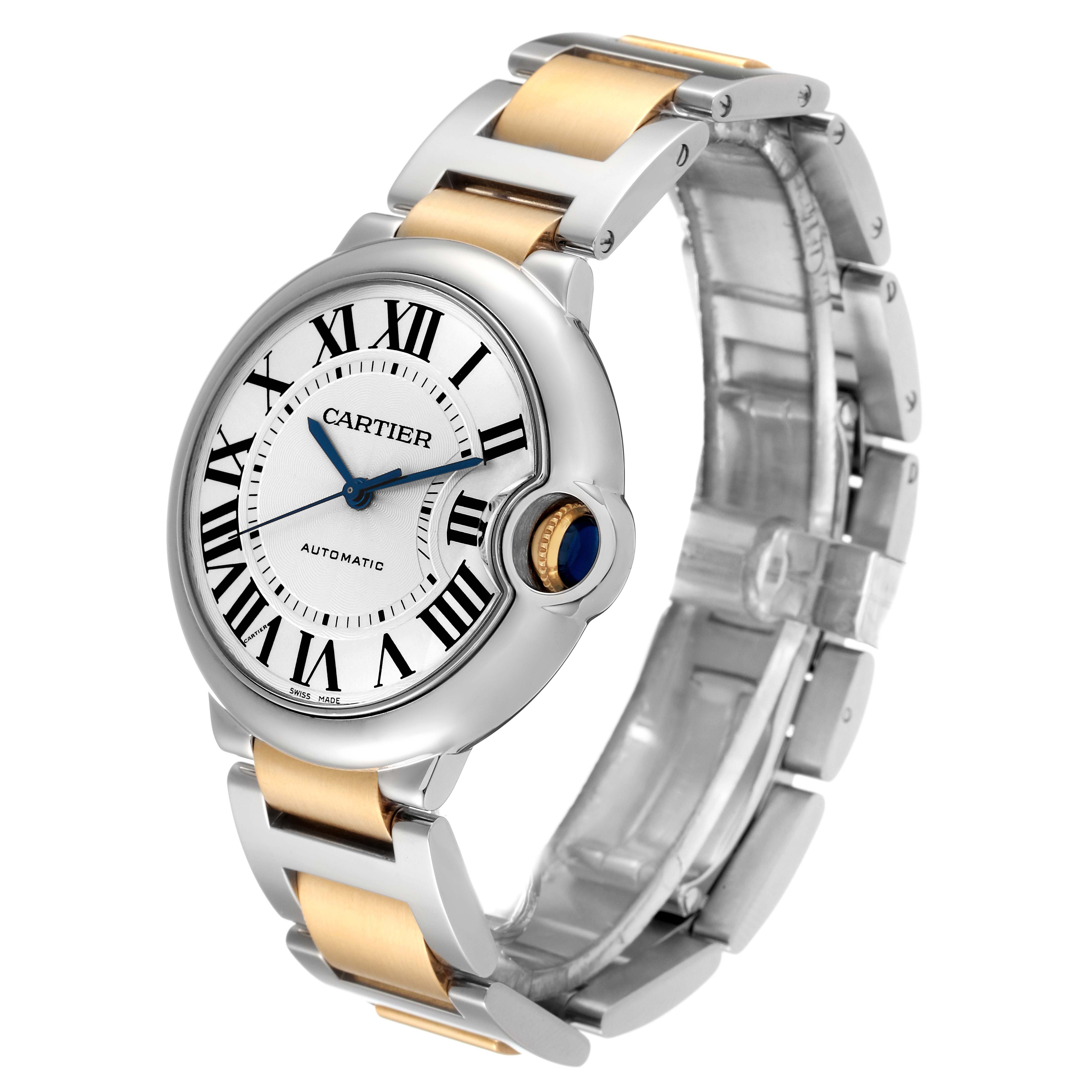 The Cartier Ballon Bleu W2BB0012 Women
s Steel and Gold (two tone) Silver Dial W2BB0012 Women
s Steel and Gold (two tone) Silver Dial watch is shown at a three-quarter angle, displaying its face, crown, and two-tone bracelet.