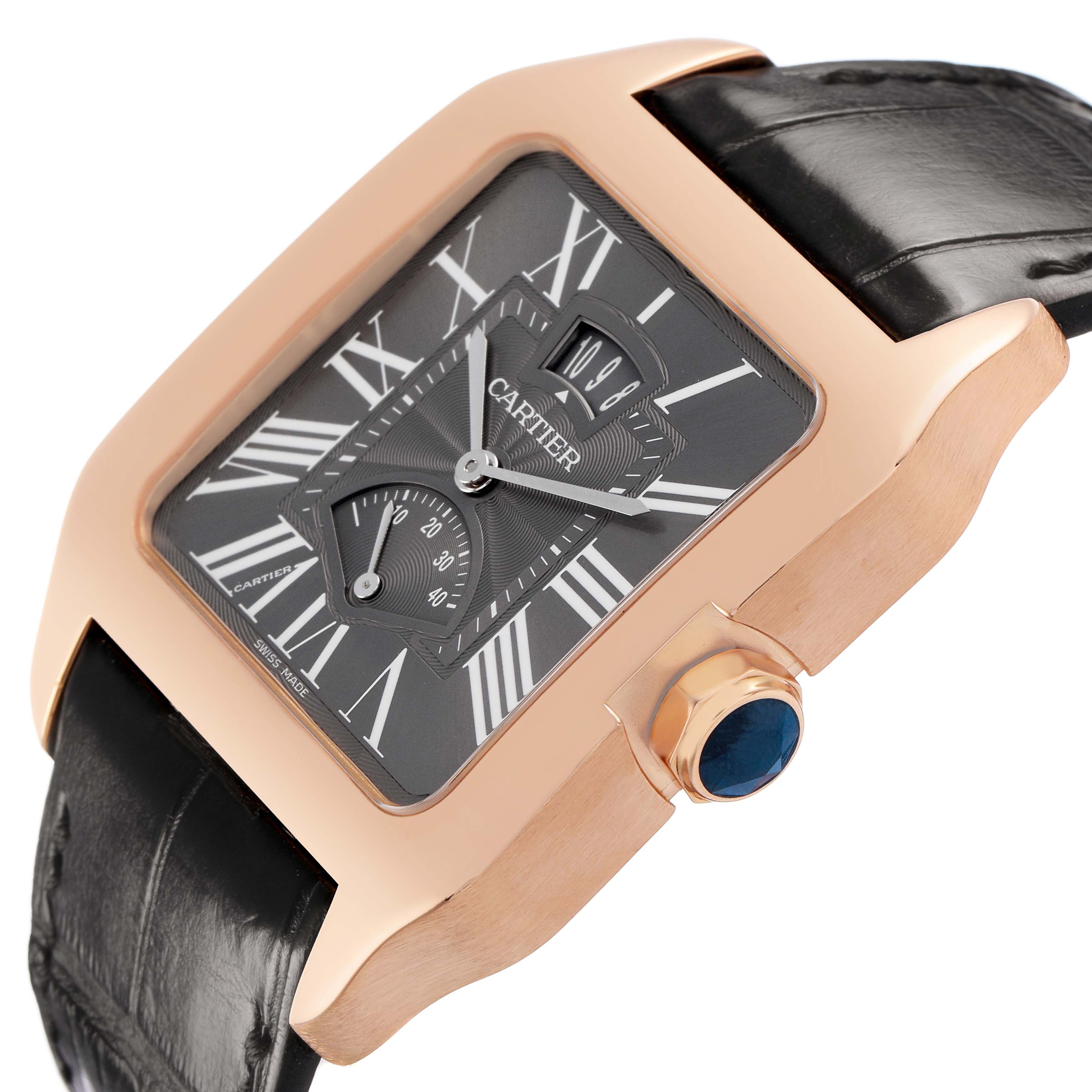 The Cartier Santos Dumont W2020068 Men's Rose Gold Grey Dial watch is shown at an angled side view, highlighting its square face, Roman numerals, rose gold case, and black leather strap.