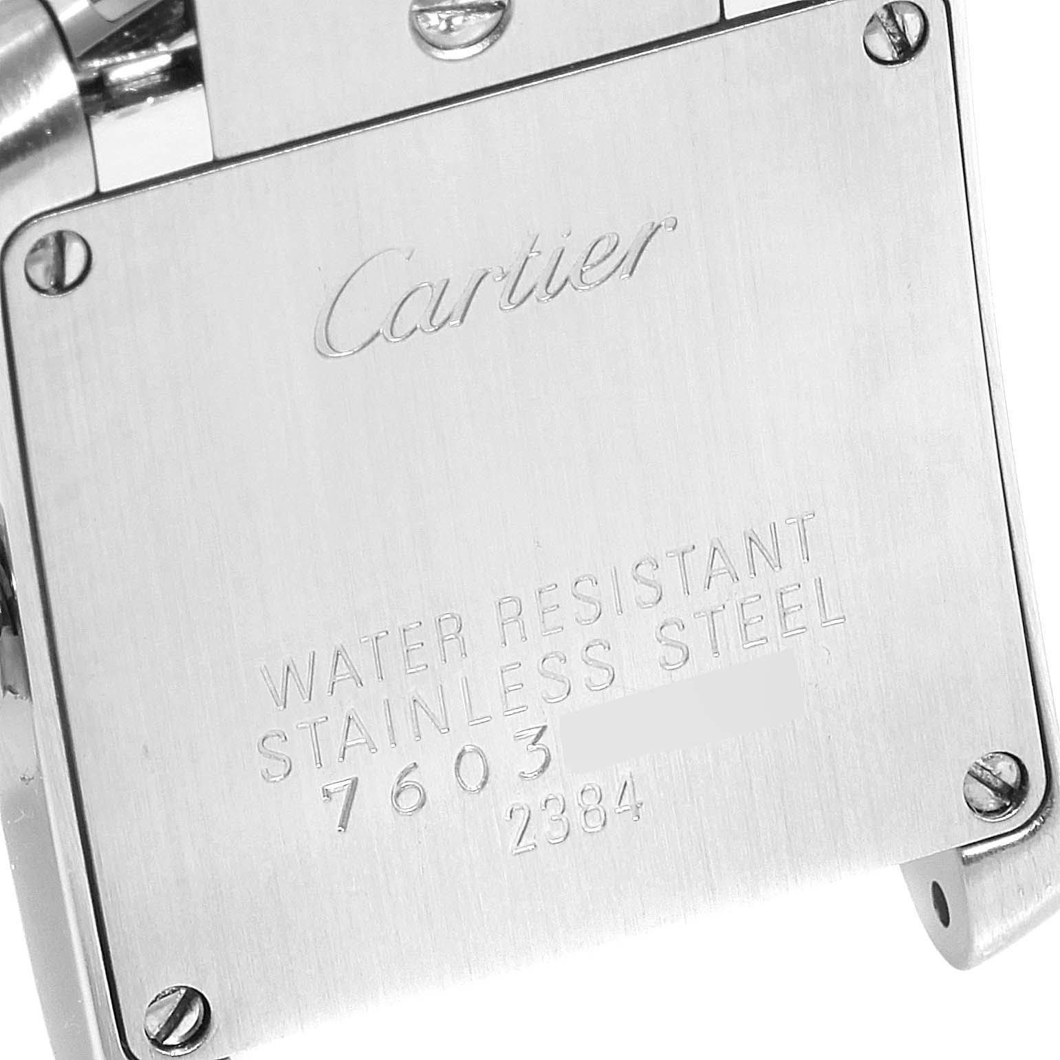 This image shows the backside and clasp area of the Cartier Tank Francaise W51007Q4 Women's Steel and Gold (two tone) Silver Dial W51007Q4 Women's Steel and Gold (two tone) Silver Dial watch, displaying its stainless steel and engraved information.