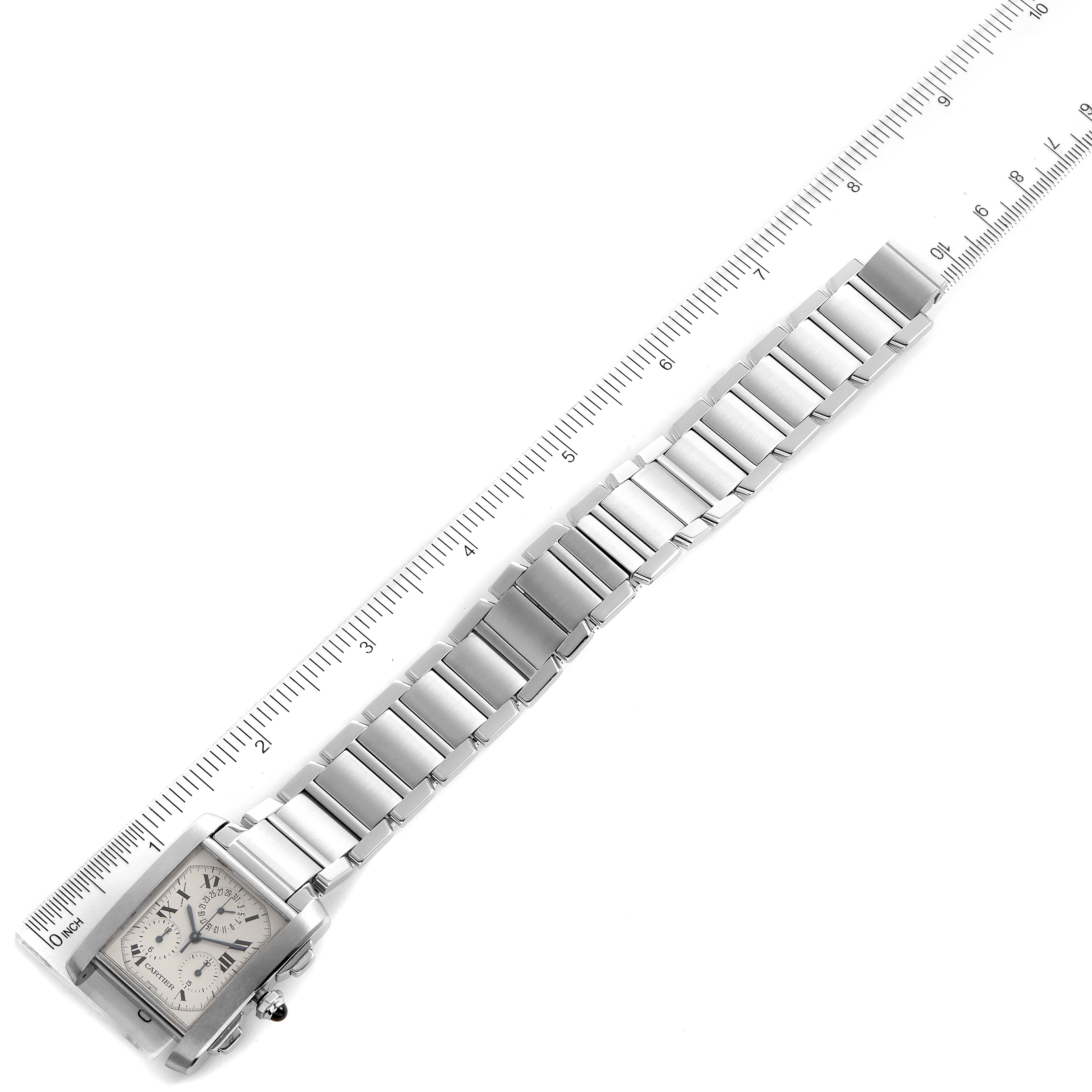 The image shows a Cartier Tank Francaise W51001Q3 Men's Stainless Steel Silver Dial W51001Q3 Men's Stainless Steel Silver Dial watch with a stainless steel bracelet, photographed at a diagonal angle alongside a ruler.