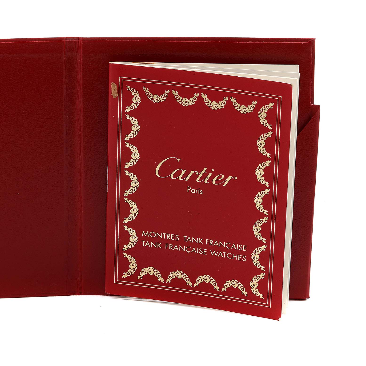 The image shows a red Cartier booklet for the Tank Francaise model, partially inserted in a folder or holder.