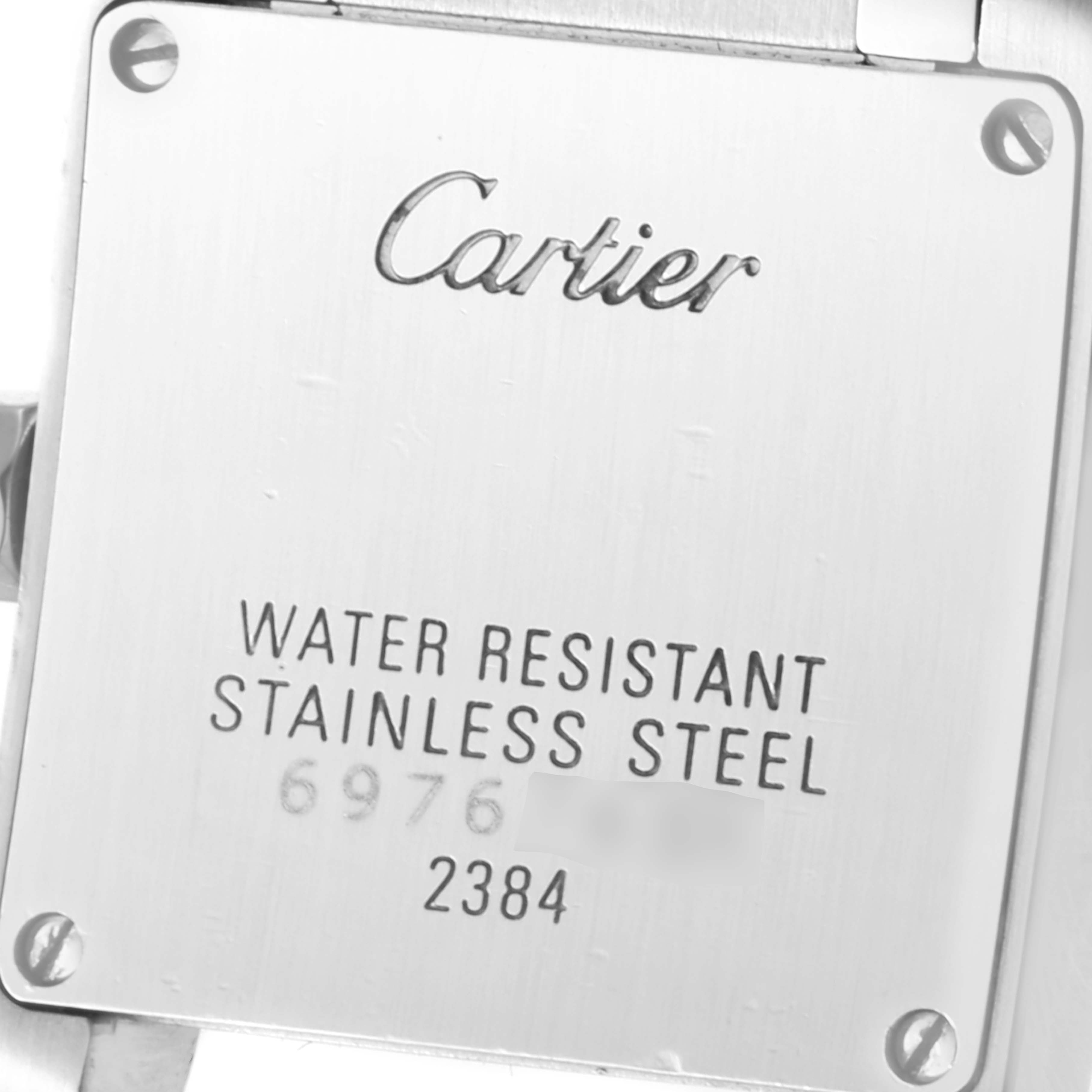 The image shows the back case of a Cartier Tank Francaise W51008Q3 Women's Stainless Steel Silver Dial W51008Q3 Women's Stainless Steel Silver Dial watch, highlighting the brand name and water resistance details.