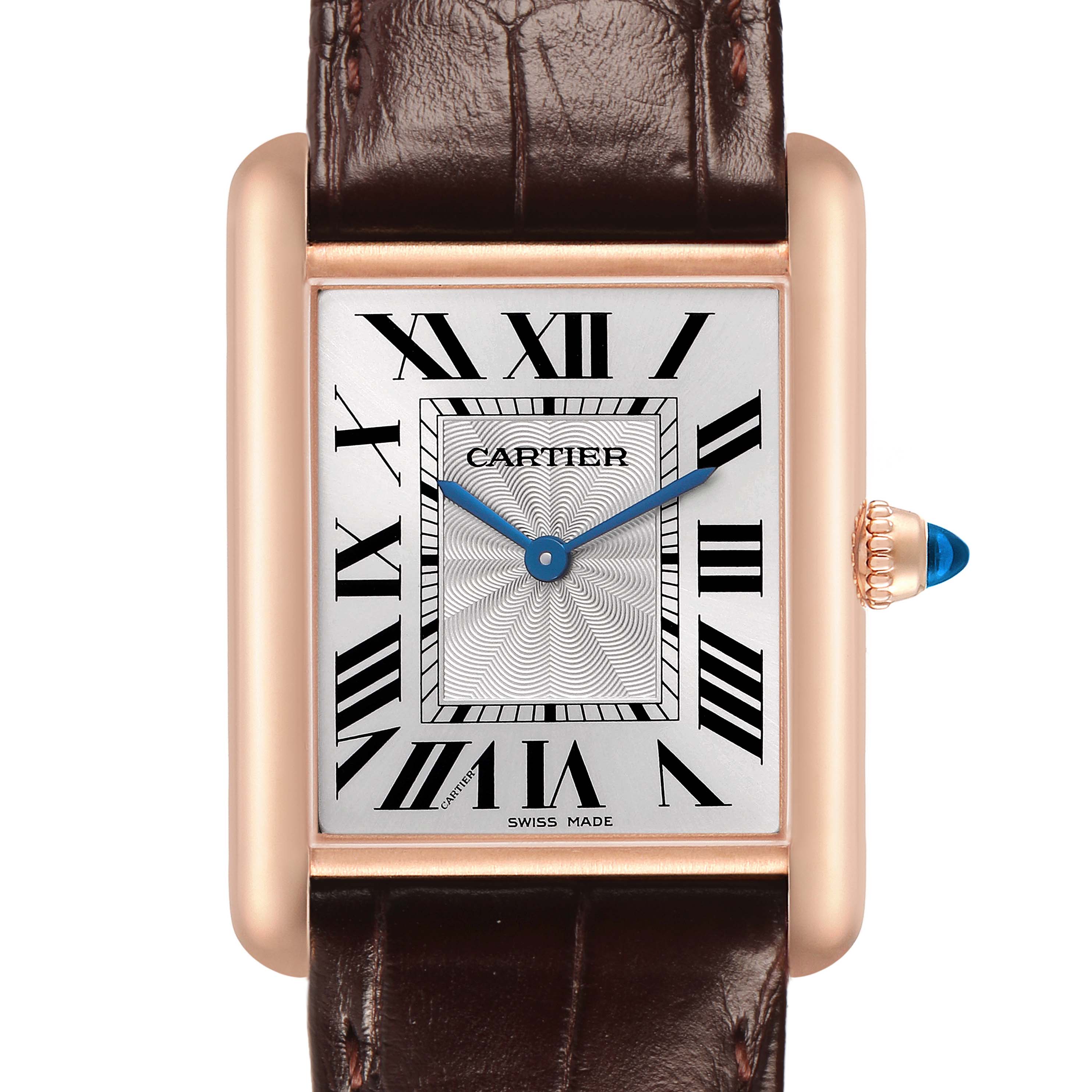 The image shows a front view of the Cartier Tank Louis WGTA0011 Men's Rose Gold Silver Dial watch, highlighting its rectangular face, roman numerals, blue hands, and leather strap.