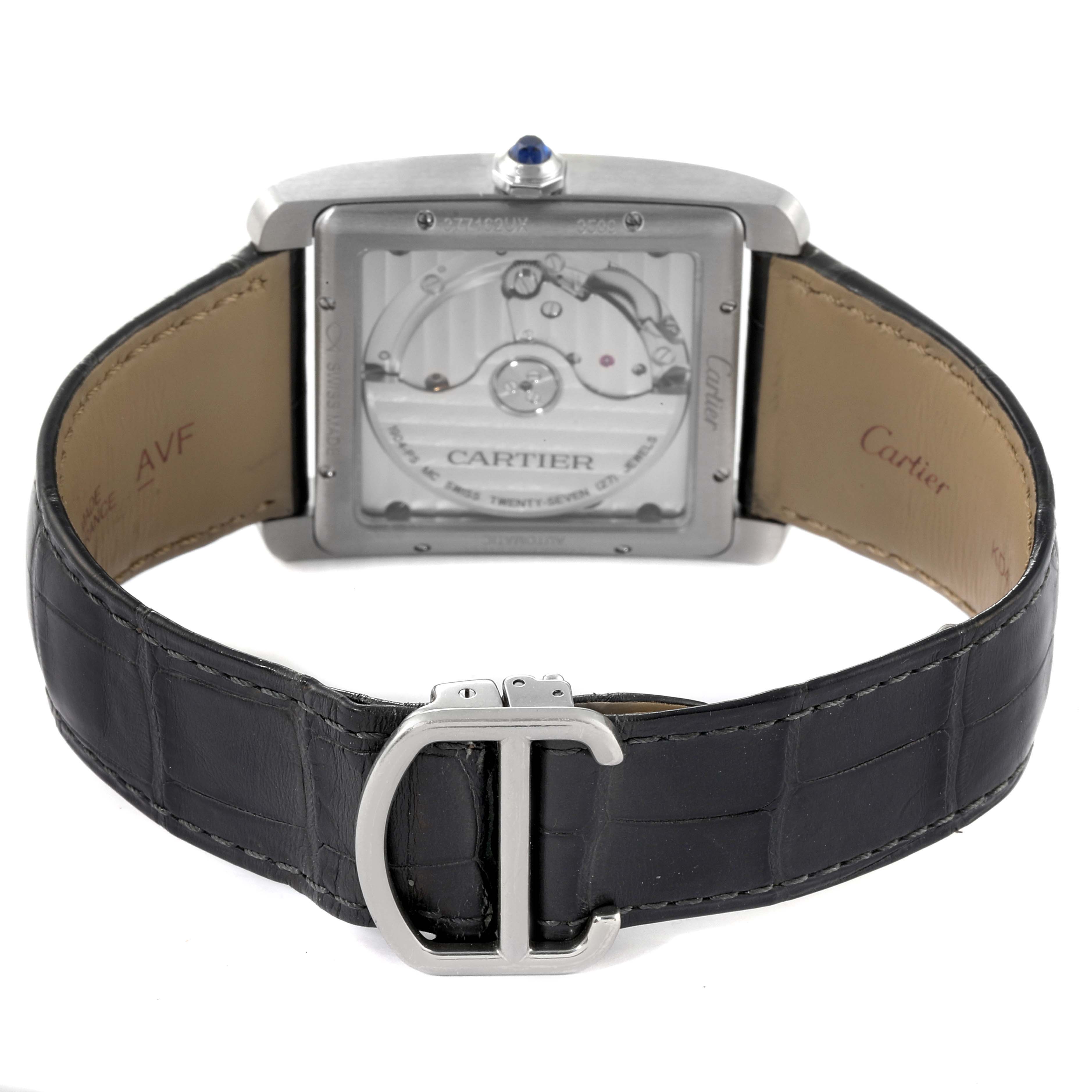 The image shows the back of the Cartier Tank MC W5330004 Men's Stainless Steel Black Dial W5330004 Men's Stainless Steel Black Dial watch, highlighting its leather strap, buckle, and movement through the transparent case back.