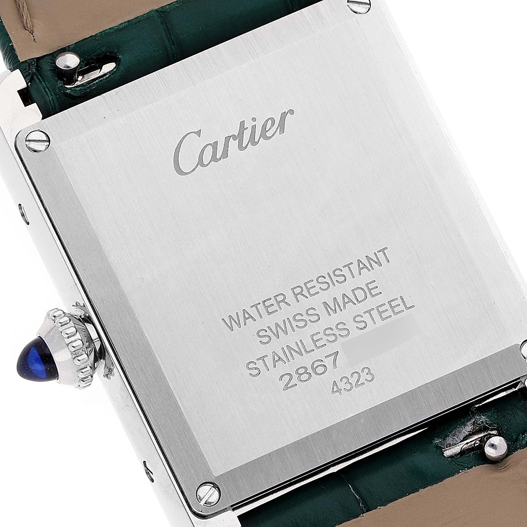 The image shows the back case of a Cartier Tank Must WSTA0056 Women's Stainless Steel Green Dial WSTA0056 Women's Stainless Steel Green Dial model watch, displaying its water resistance, material, and Swiss-made inscription.