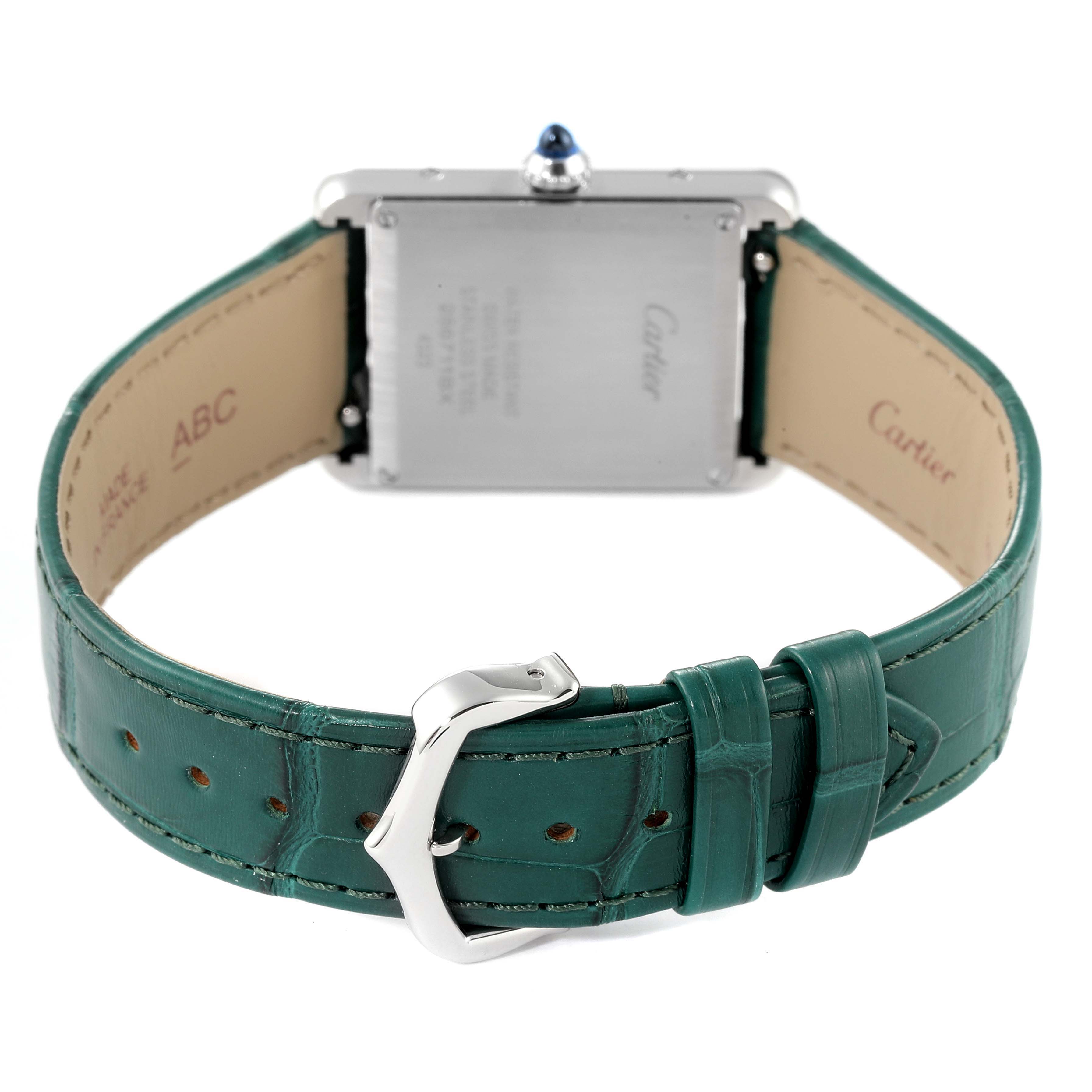The image shows the Cartier Tank Must WSTA0056 Women's Stainless Steel Green Dial WSTA0056 Women's Stainless Steel Green Dial watch from the back, highlighting the clasp and green leather strap.