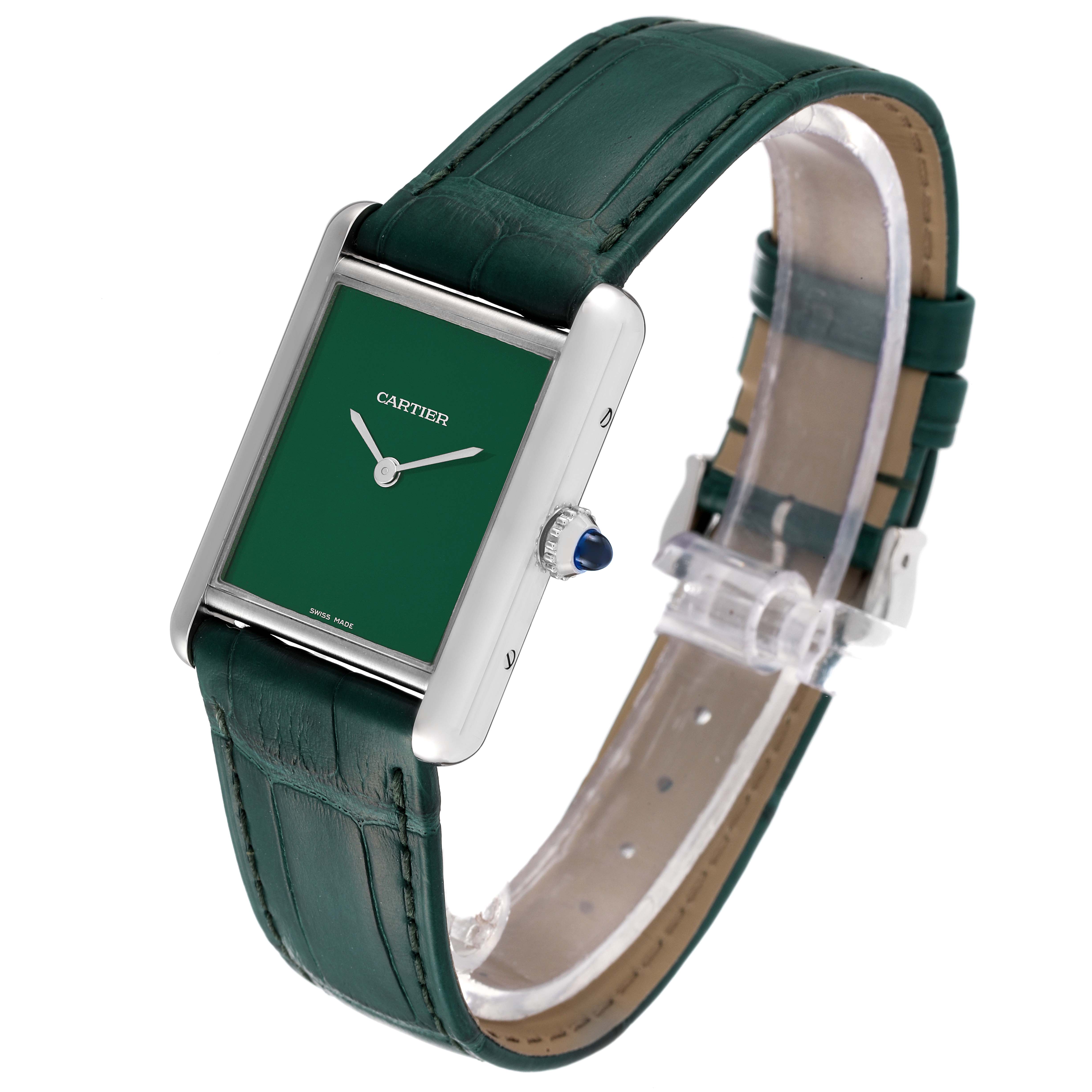 The Tank Must model by Cartier is shown at a slight angle, highlighting the green dial, silver case, and green leather strap.