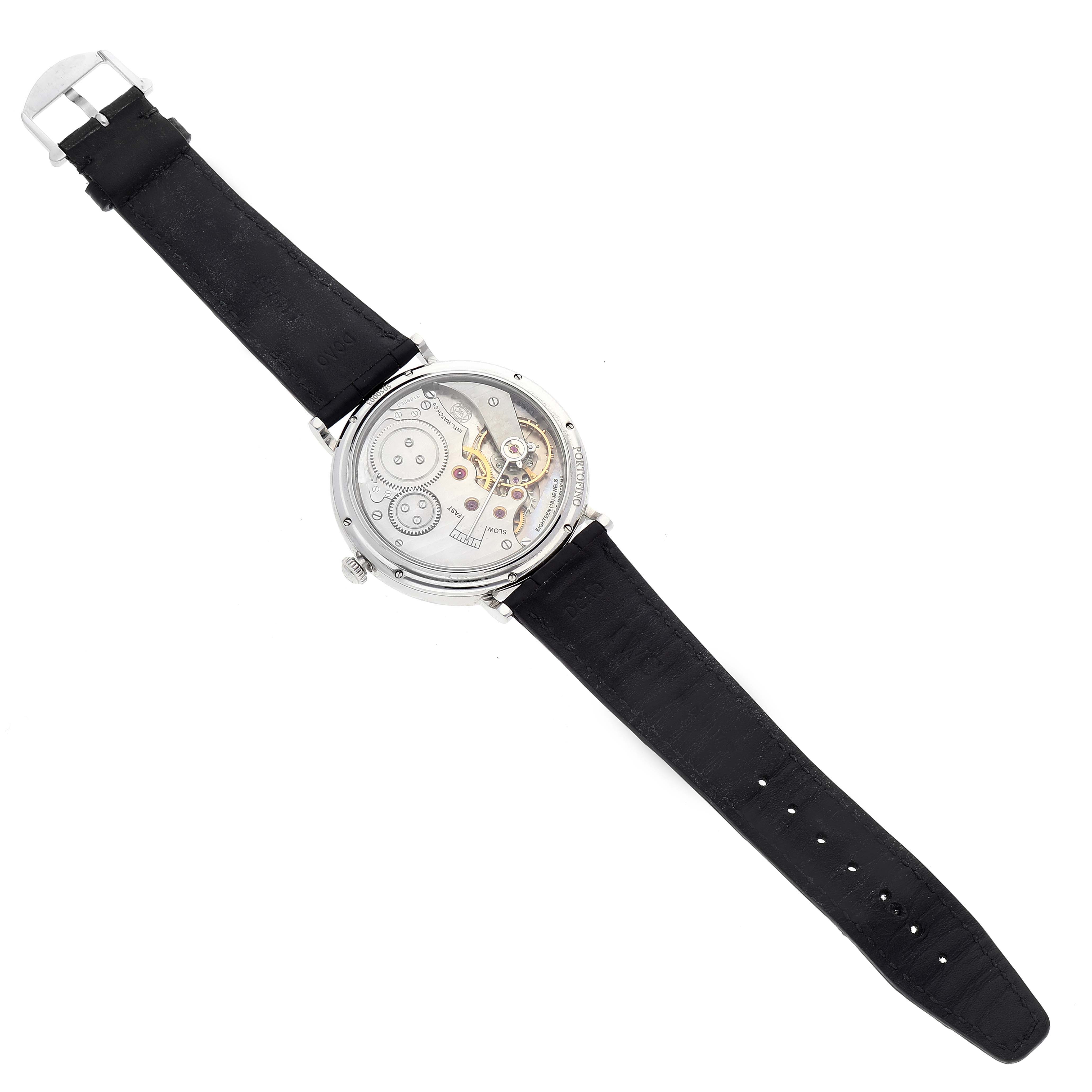 The image shows the back view of an IWC Portofino IW544801 Men's Stainless Steel Black Dial IW544801 Men's Stainless Steel Black Dial watch, highlighting its exposed mechanical movements and black leather strap.