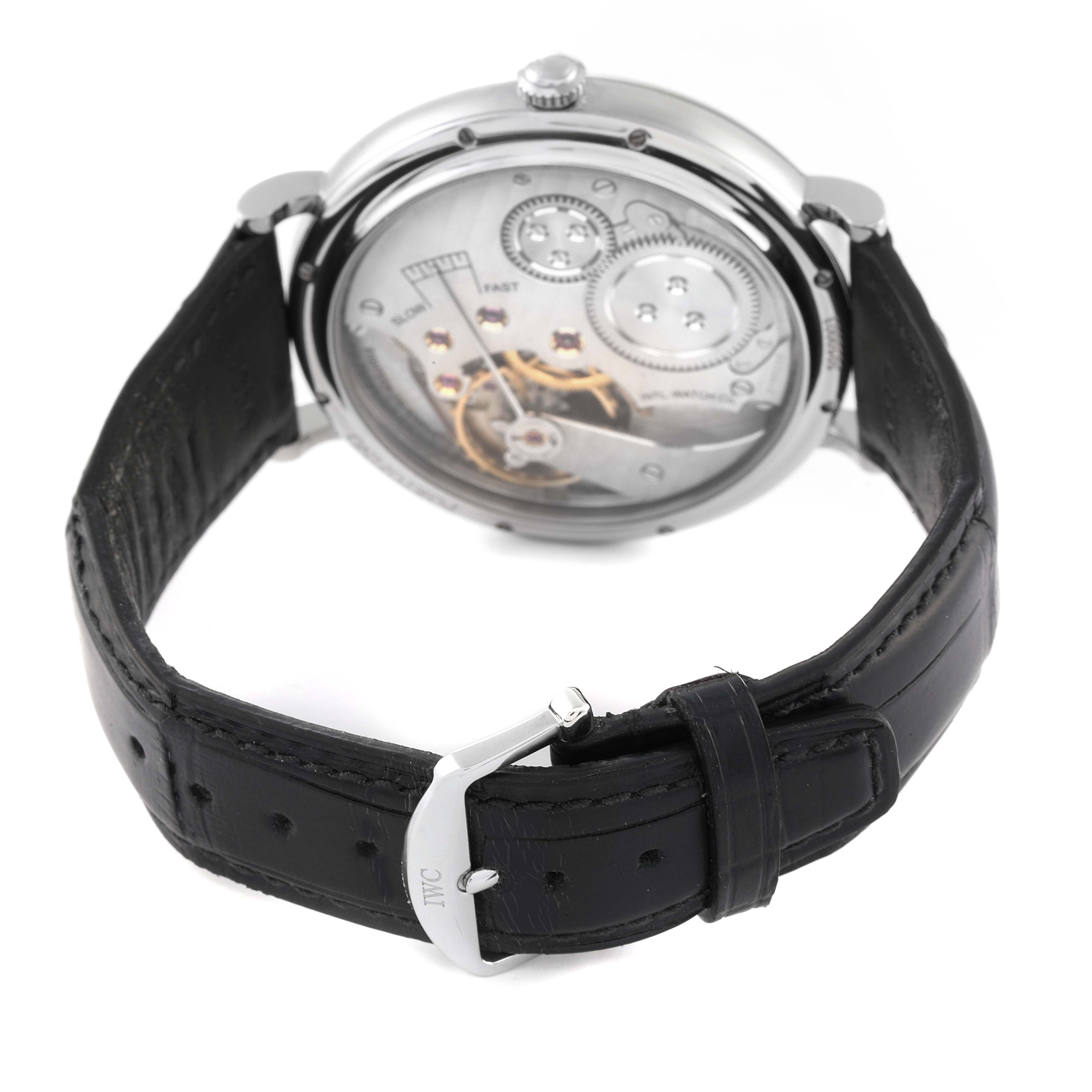 The image shows the back view of the IWC Portofino IW544801 Men's Stainless Steel Black Dial IW544801 Men's Stainless Steel Black Dial watch, displaying its movement and leather strap with the IWC buckle.