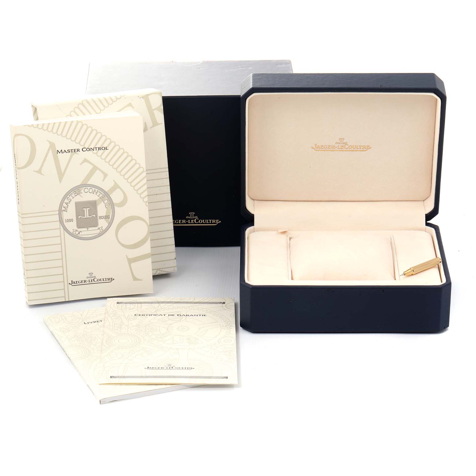 The image shows the packaging, manual, and warranty papers for the Jaeger-LeCoultre Master Control watch, with an open watch box.