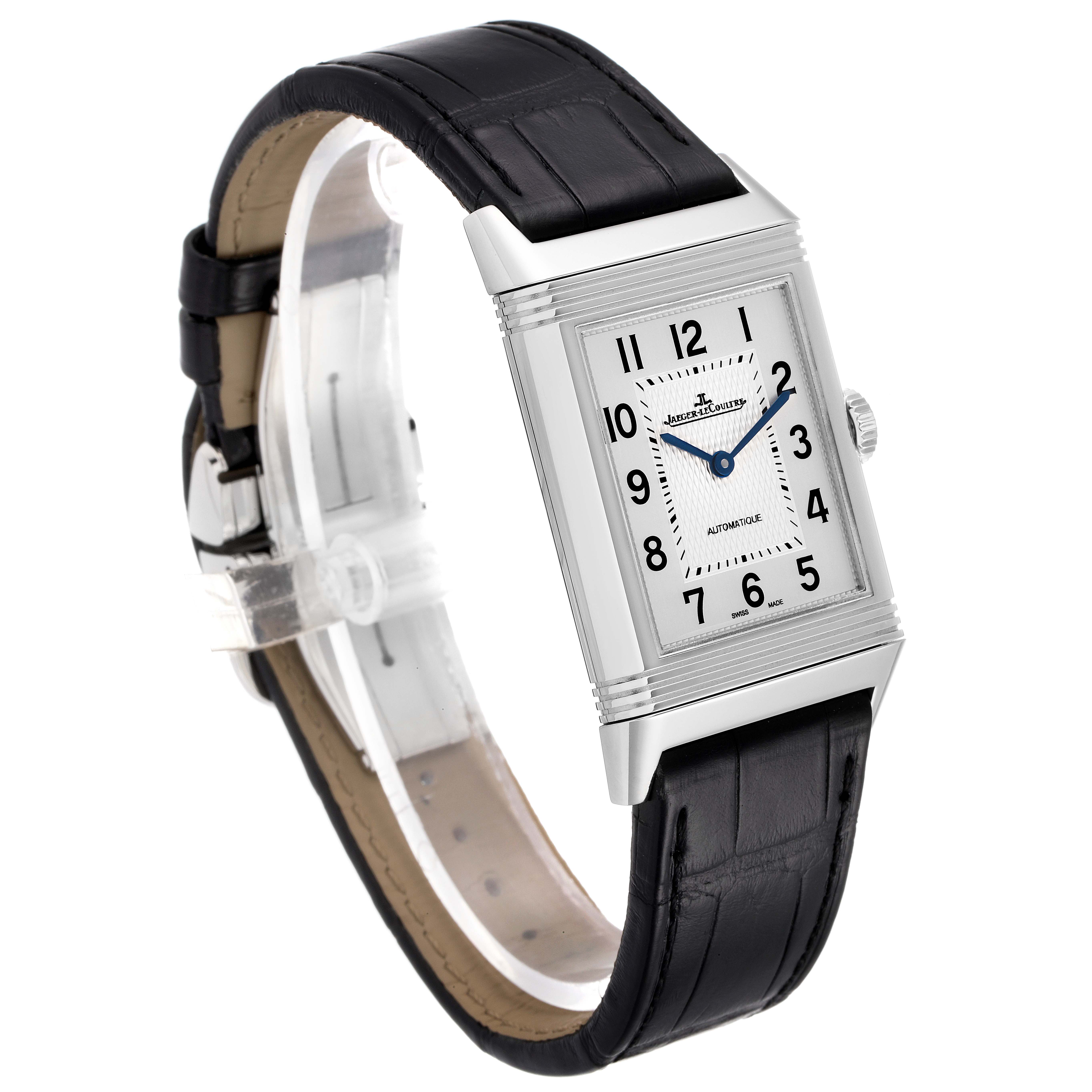 The Reverso model by Jaeger LeCoultre is shown at a three-quarter angle, highlighting the rectangular face, silver case, and black leather strap.