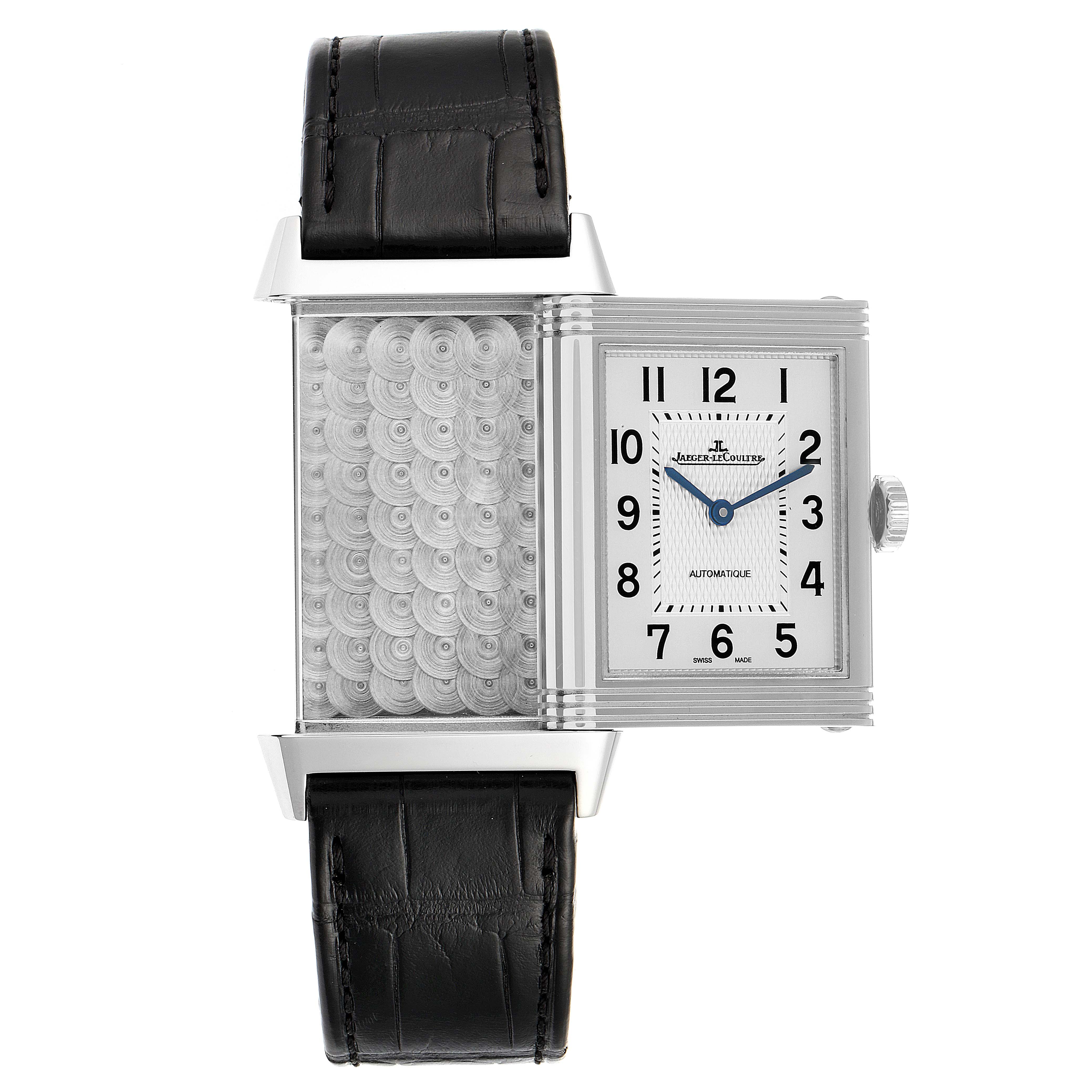 The image shows the Jaeger LeCoultre Reverso Q3828420 Men's Stainless Steel Silver Dial Q3828420 Men's Stainless Steel Silver Dial watch with its face partially flipped to reveal the decorative reverse side.