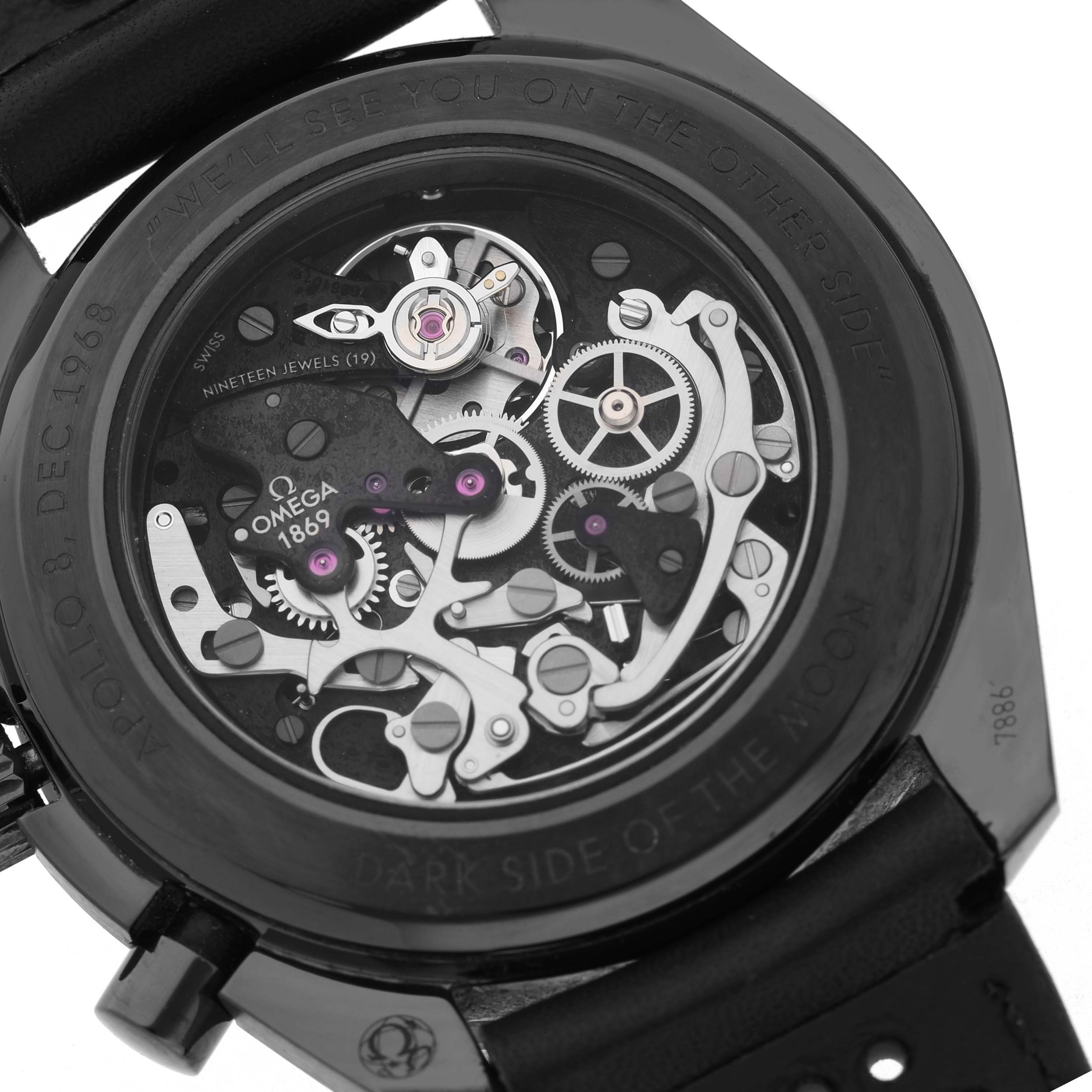 The image shows the back of an Omega Speedmaster 311.92.44.30.01.001 Men's Ceramic Black Dial watch, highlighting its intricate mechanical movement.