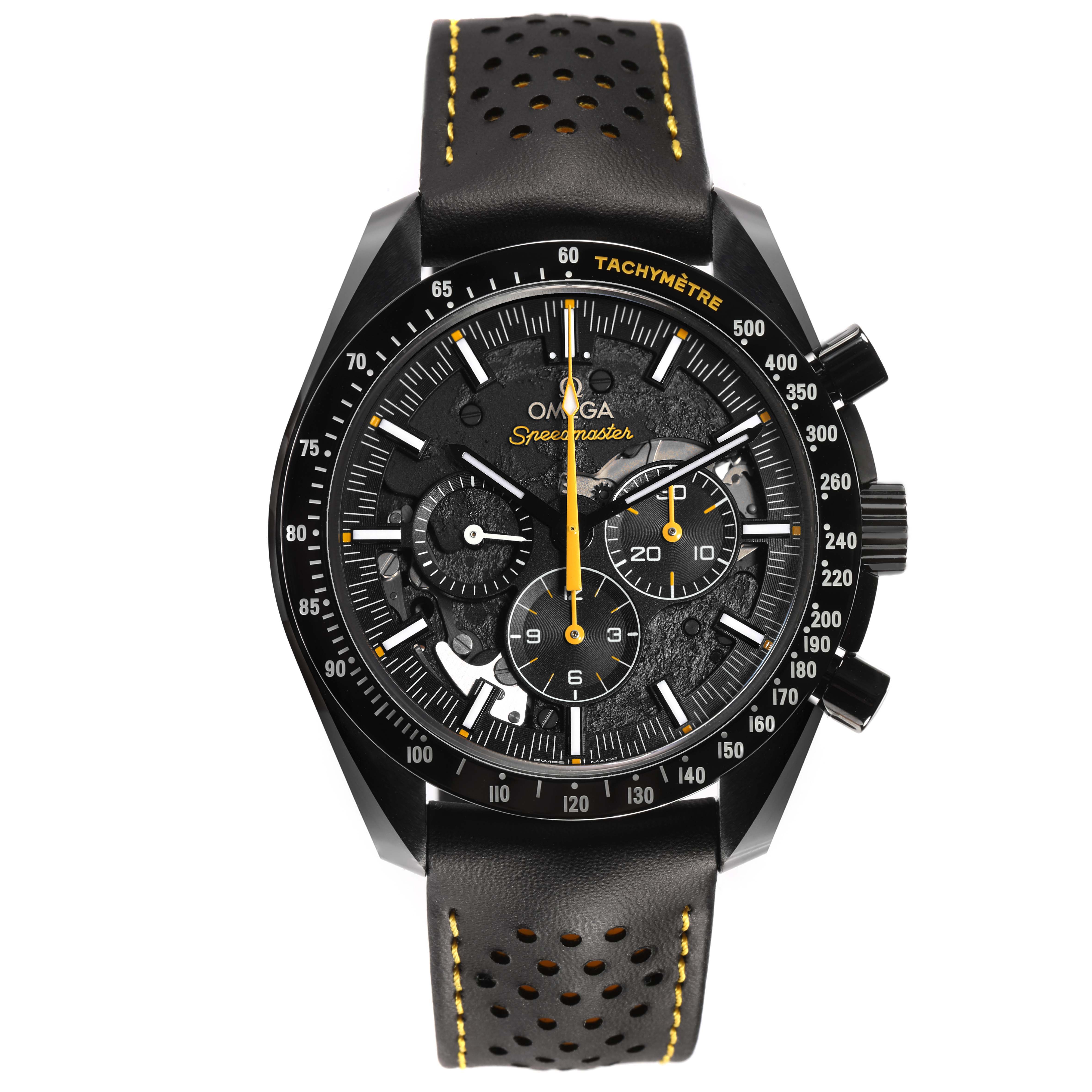The Omega Speedmaster 311.92.44.30.01.001 Men's Ceramic Black Dial watch is shown from a front angle, highlighting the dial, bezel, and black perforated strap with yellow stitching.