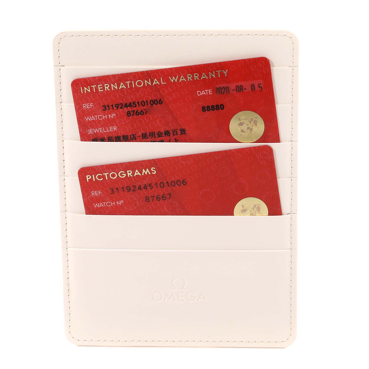 The image shows an Omega Speedmaster 311.92.44.51.01.006 Men's Ceramic Black Dial 311.92.44.51.01.006 Men's Ceramic Black Dial warranty and pictogram cards in a white card holder.