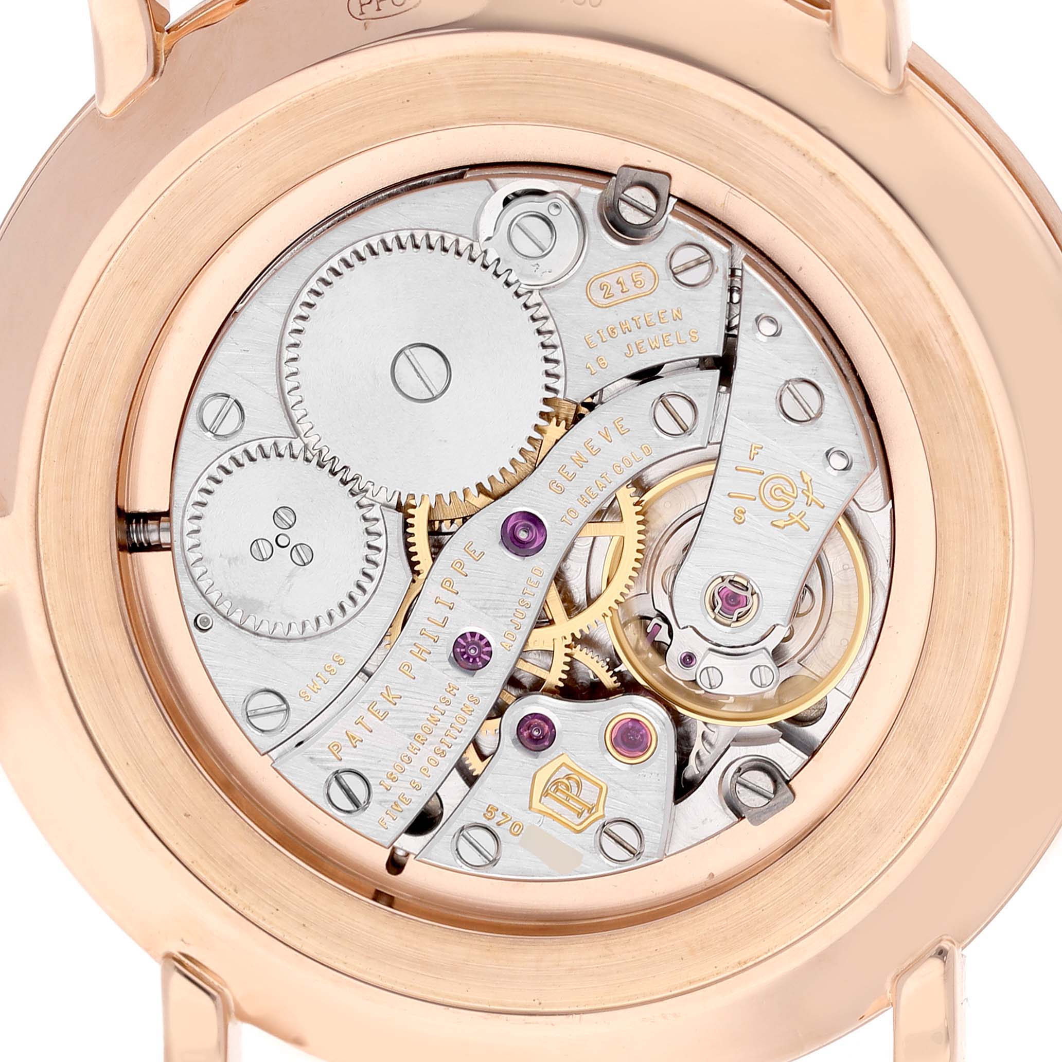 The image shows the back view of a Patek Philippe Calatrava 5119R Men's Rose Gold White Dial watch, highlighting its intricate movement and gears.