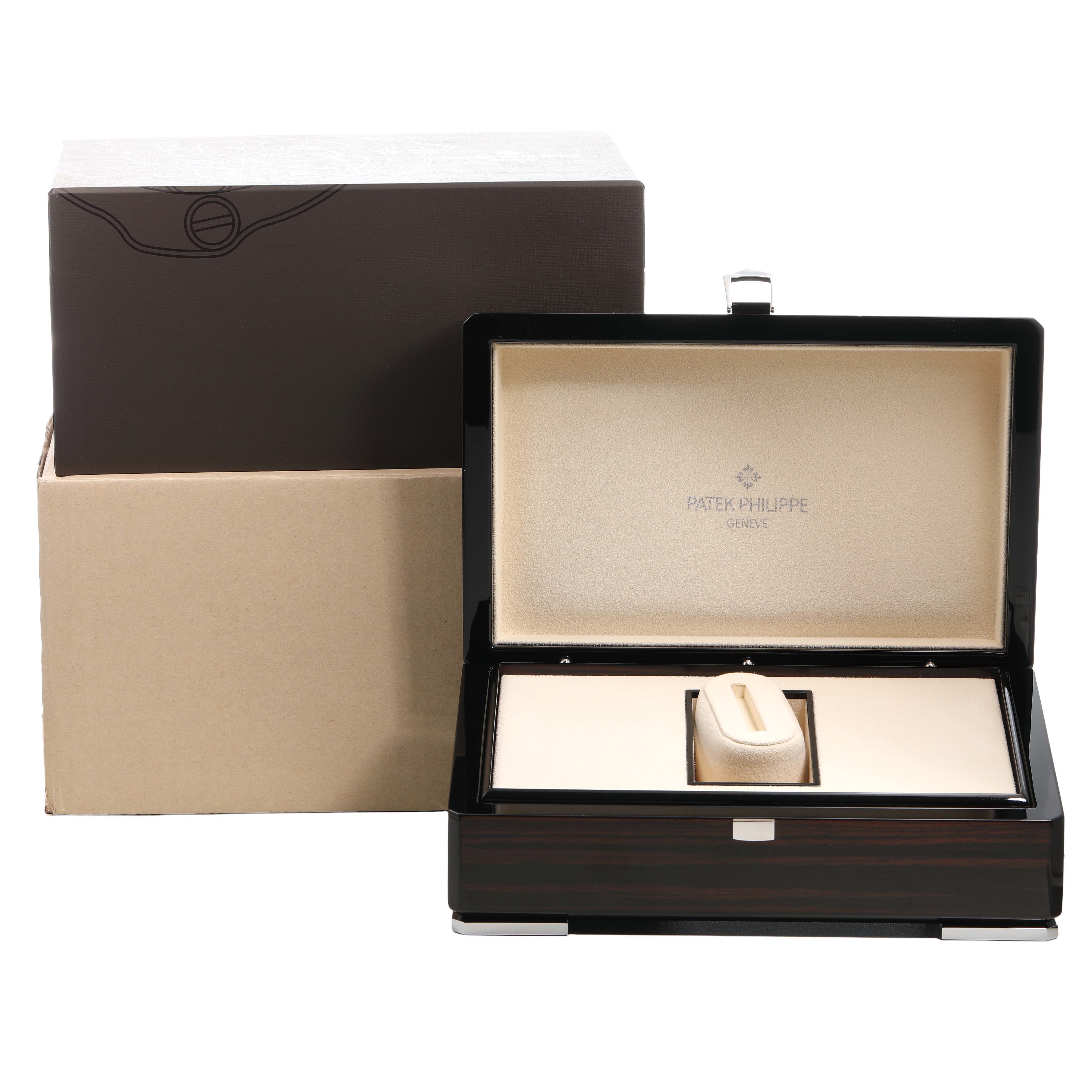 The image shows a Patek Philippe Calatrava 5226G Men's White Gold Grey Dial watch box, open, revealing an interior cushion for the watch.