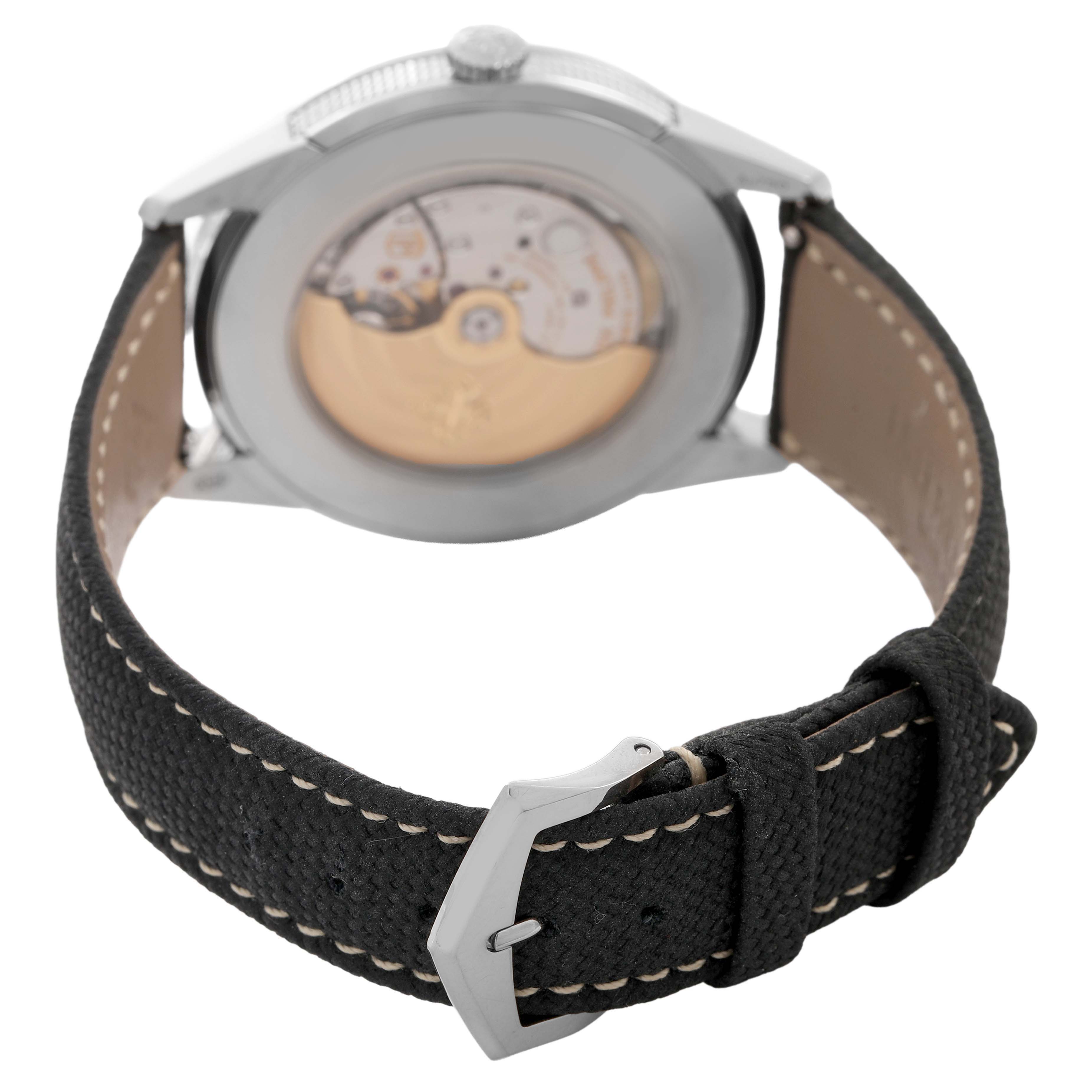 The image shows the back of a Patek Philippe Calatrava 5226G Men's White Gold Grey Dial watch, highlighting the movement and leather strap with buckle.