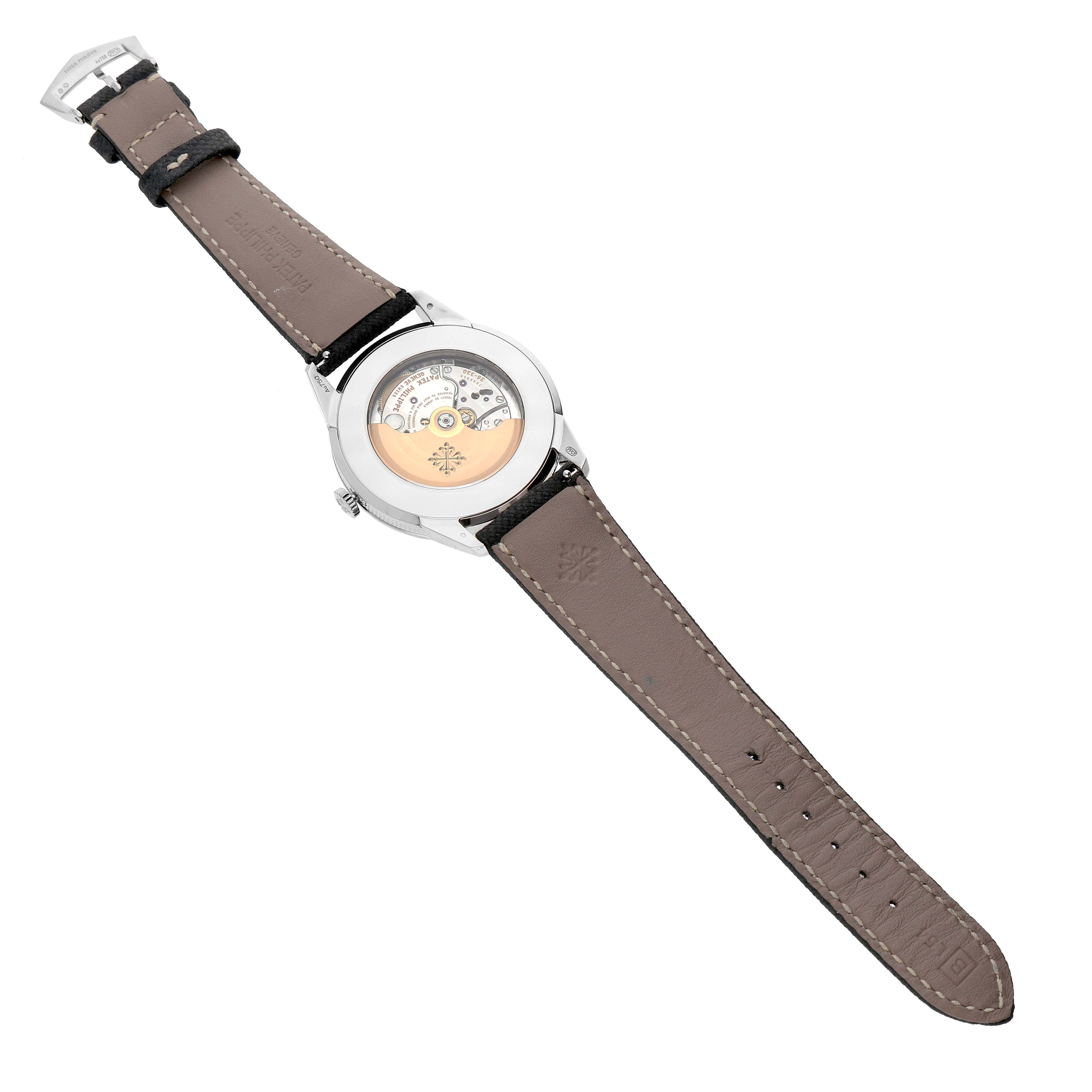 The Patek Philippe Calatrava 5226G Men's White Gold Grey Dial watch is shown from the back, highlighting the movement and leather strap.