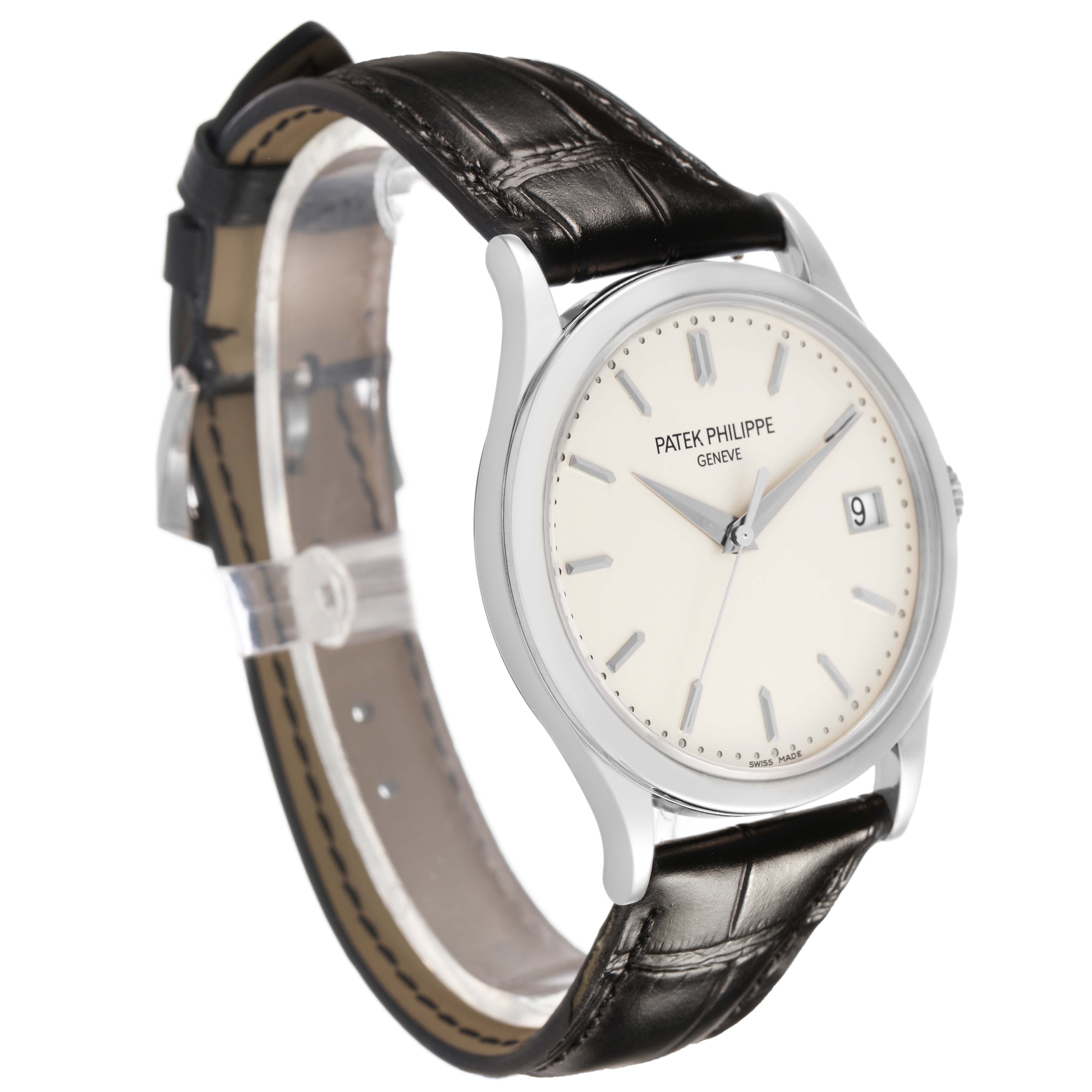 The Patek Philippe Calatrava 5296G Men's White Gold Silver Dial watch is shown at a three-quarter angle, displaying its face, date window, and leather strap.