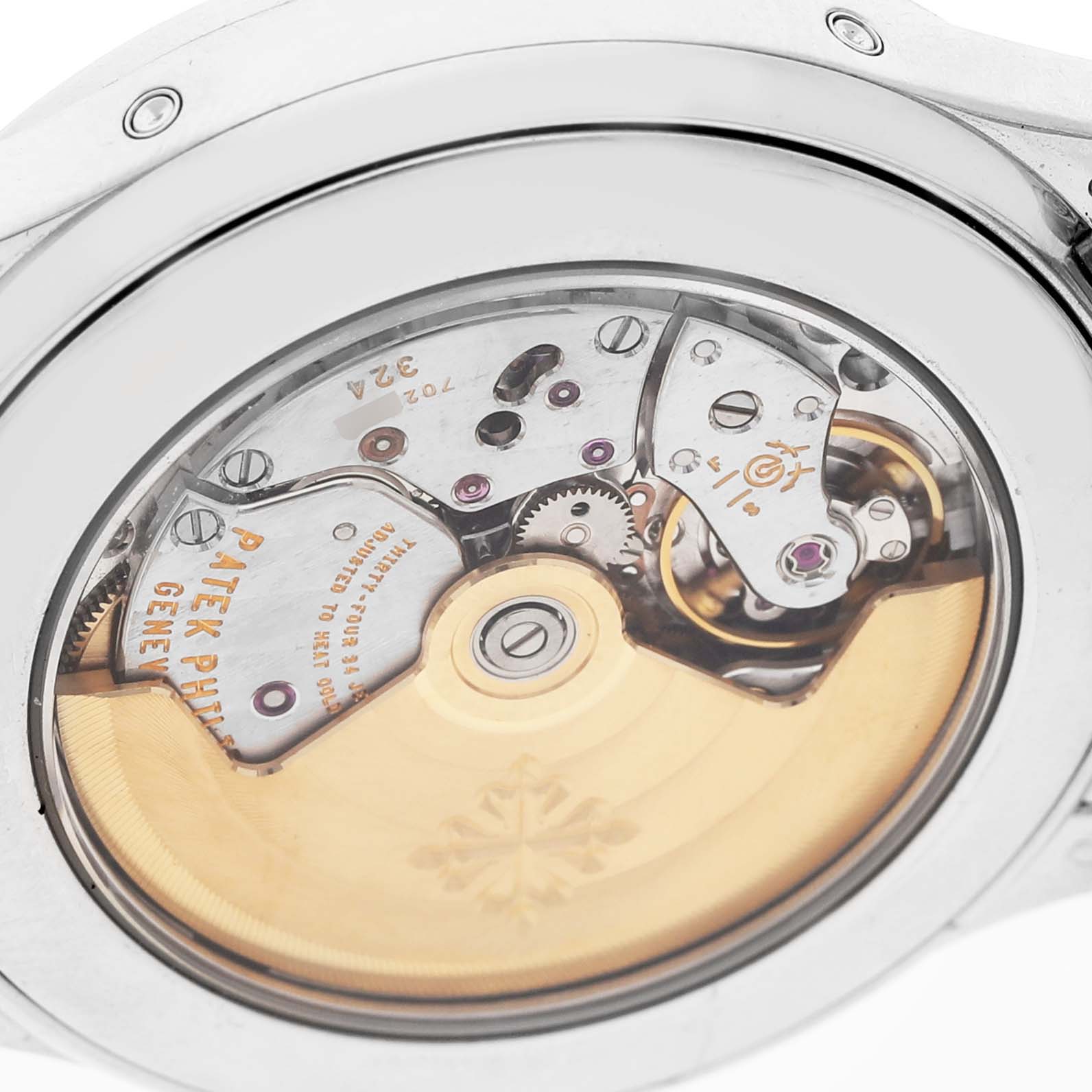 The image shows the back view of a Patek Philippe Complications 5396G Men's White Gold Silver Dial model, highlighting its intricate movement and rotor.