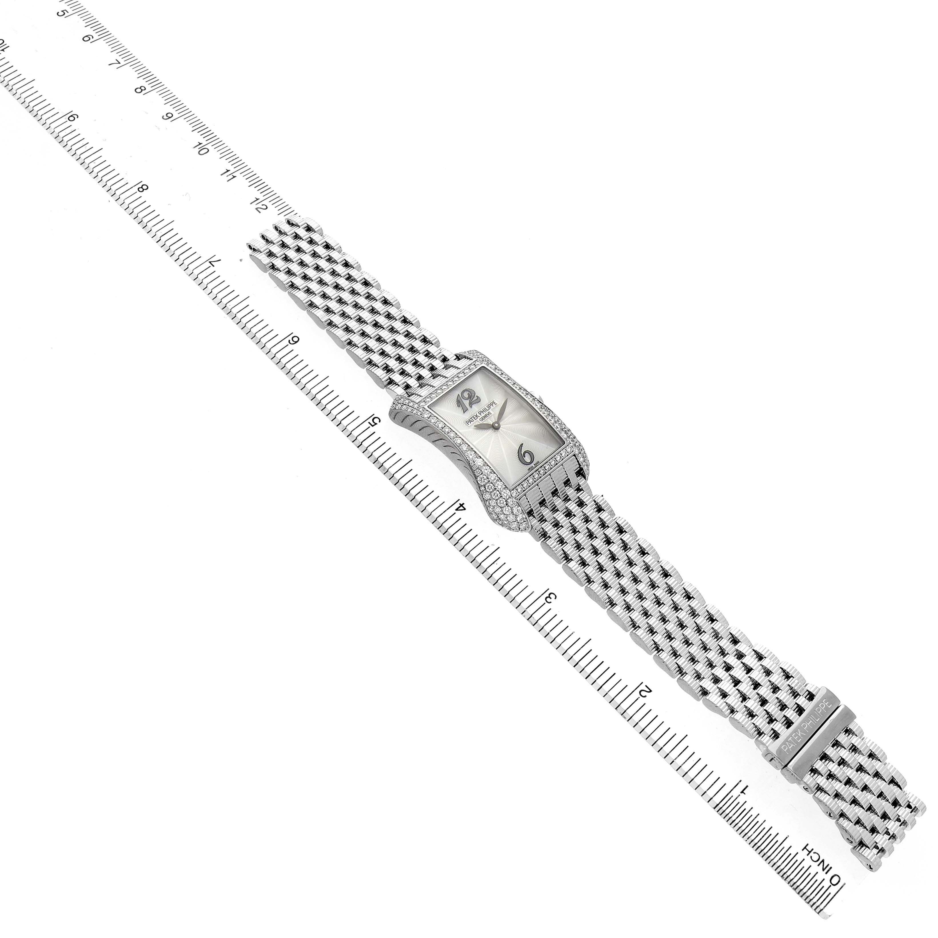 The Patek Philippe Gondolo 4972G Women's White Gold Mother of Pearl Dial watch is shown diagonally, displaying its face, diamond bezel, and bracelet over a ruler for scale.