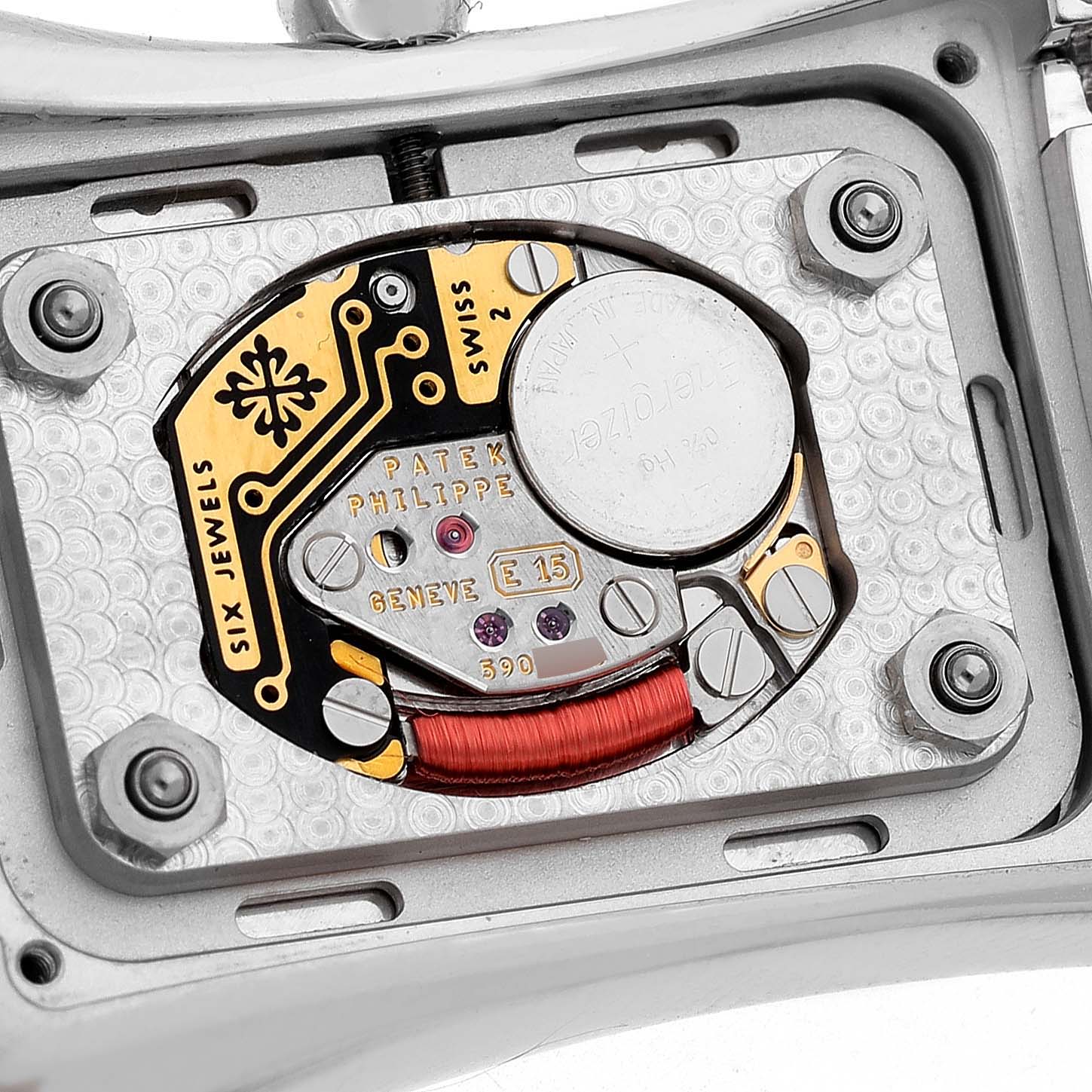 The image shows the backside of a Patek Philippe Gondolo 4972G Women's White Gold Mother of Pearl Dial watch, displaying its intricate movement and components.