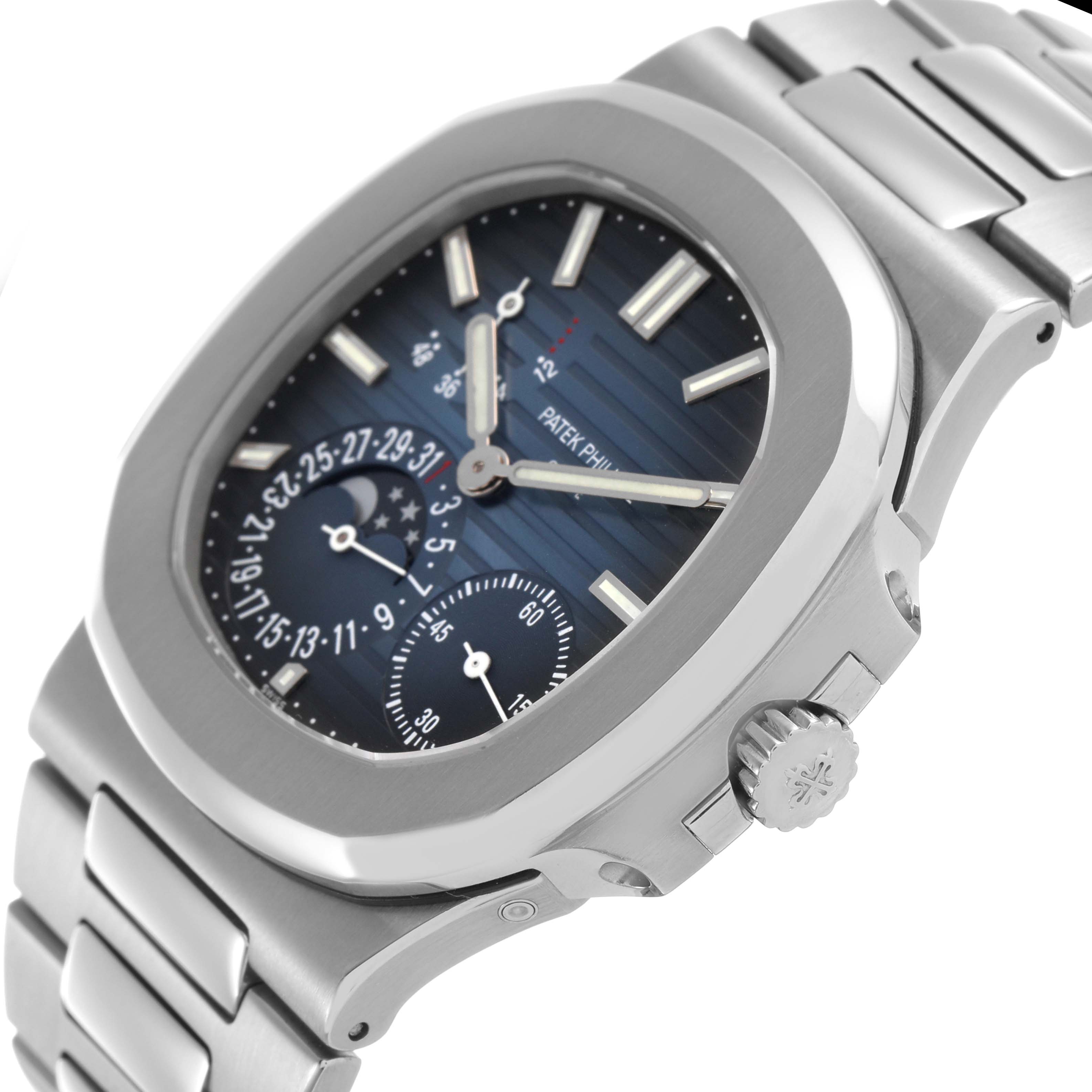 The image shows a side angle of the Patek Philippe Nautilus 5712A Men's Stainless Steel Blue Dial, highlighting its case, dial, subdials, and crown.