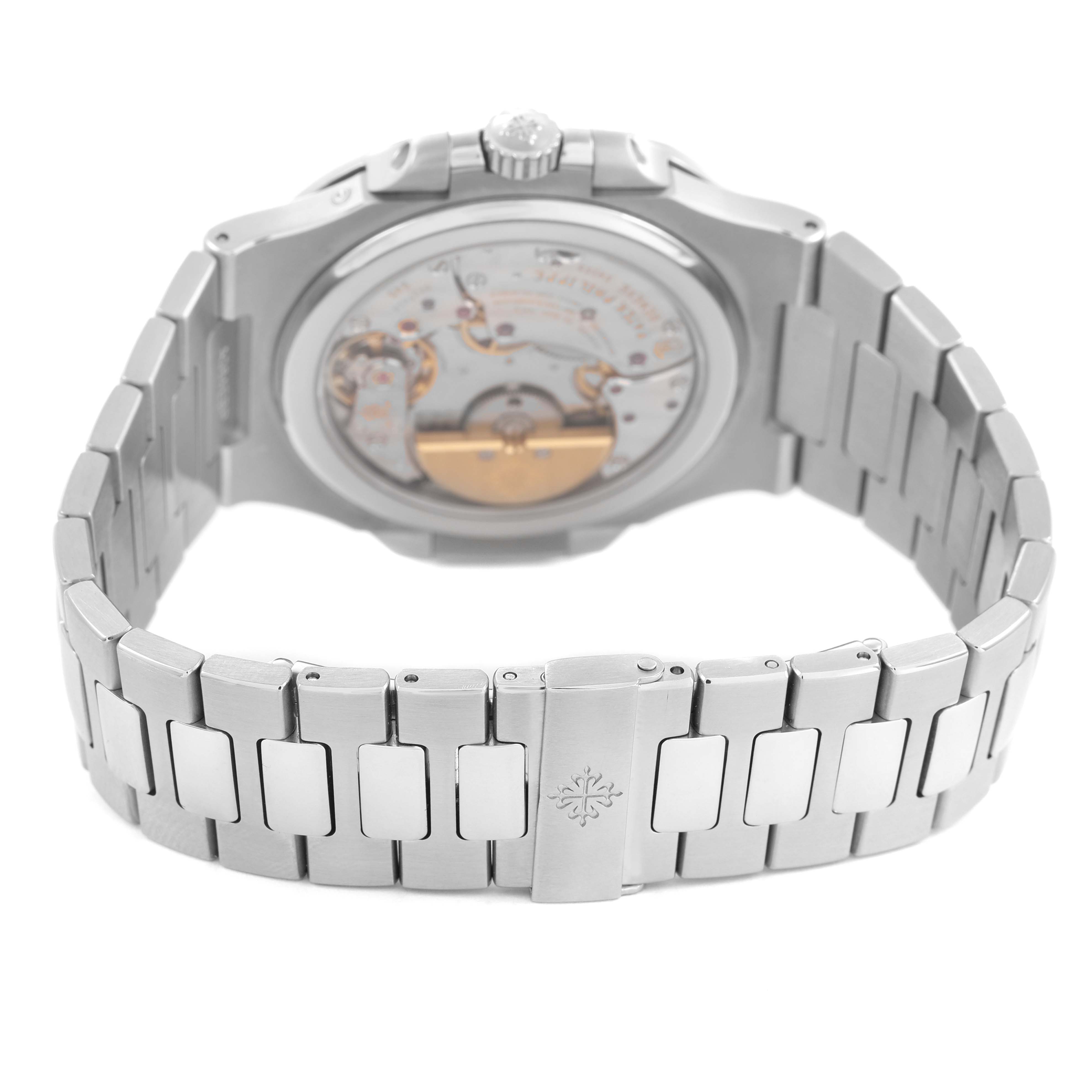 The image shows the back and bracelet of a Patek Philippe Nautilus 5712A Men's Stainless Steel Blue Dial watch, highlighting the movement and clasp details.