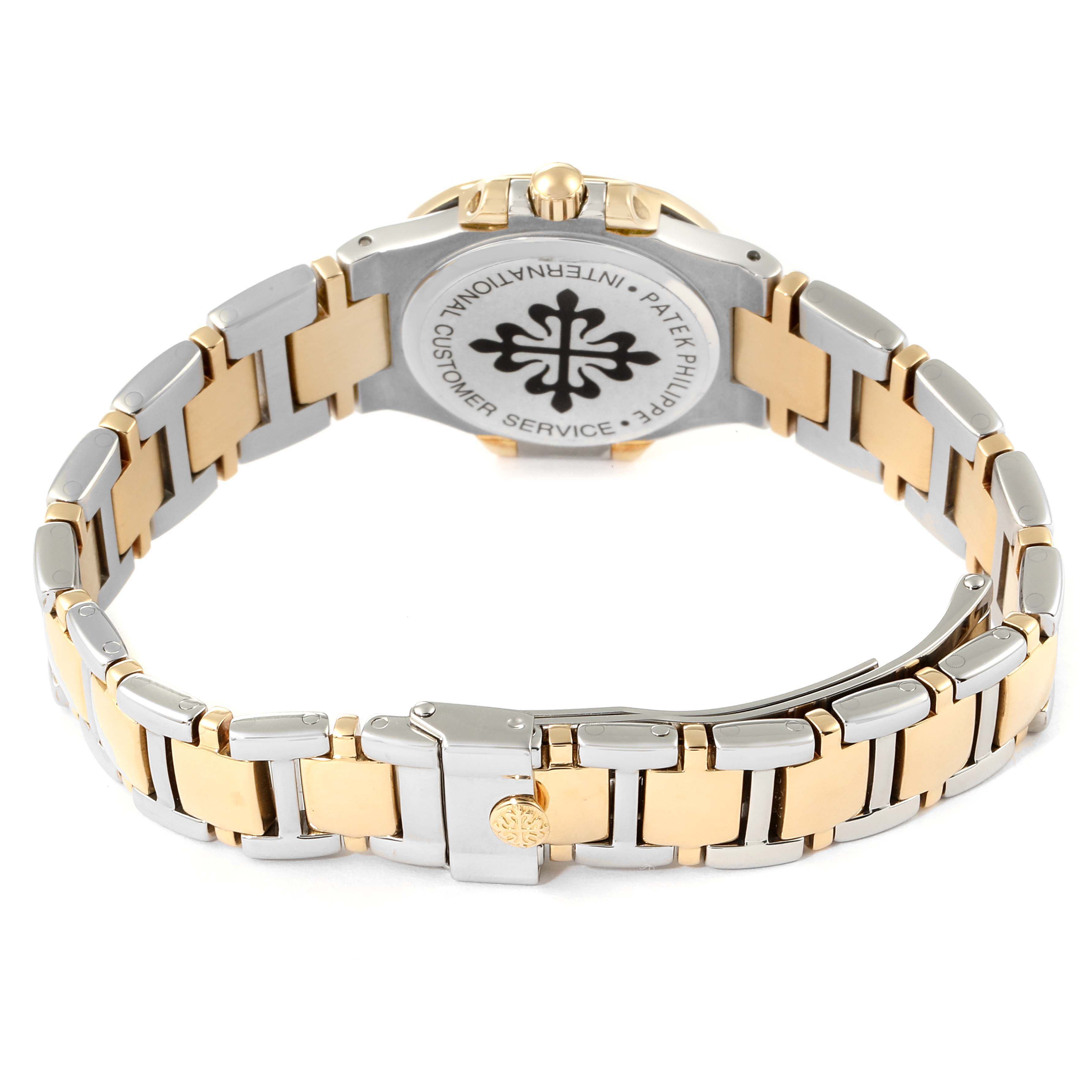 The image shows the back view of the Nautilus watch by Patek Philippe, highlighting its two-tone bracelet and closed clasp.