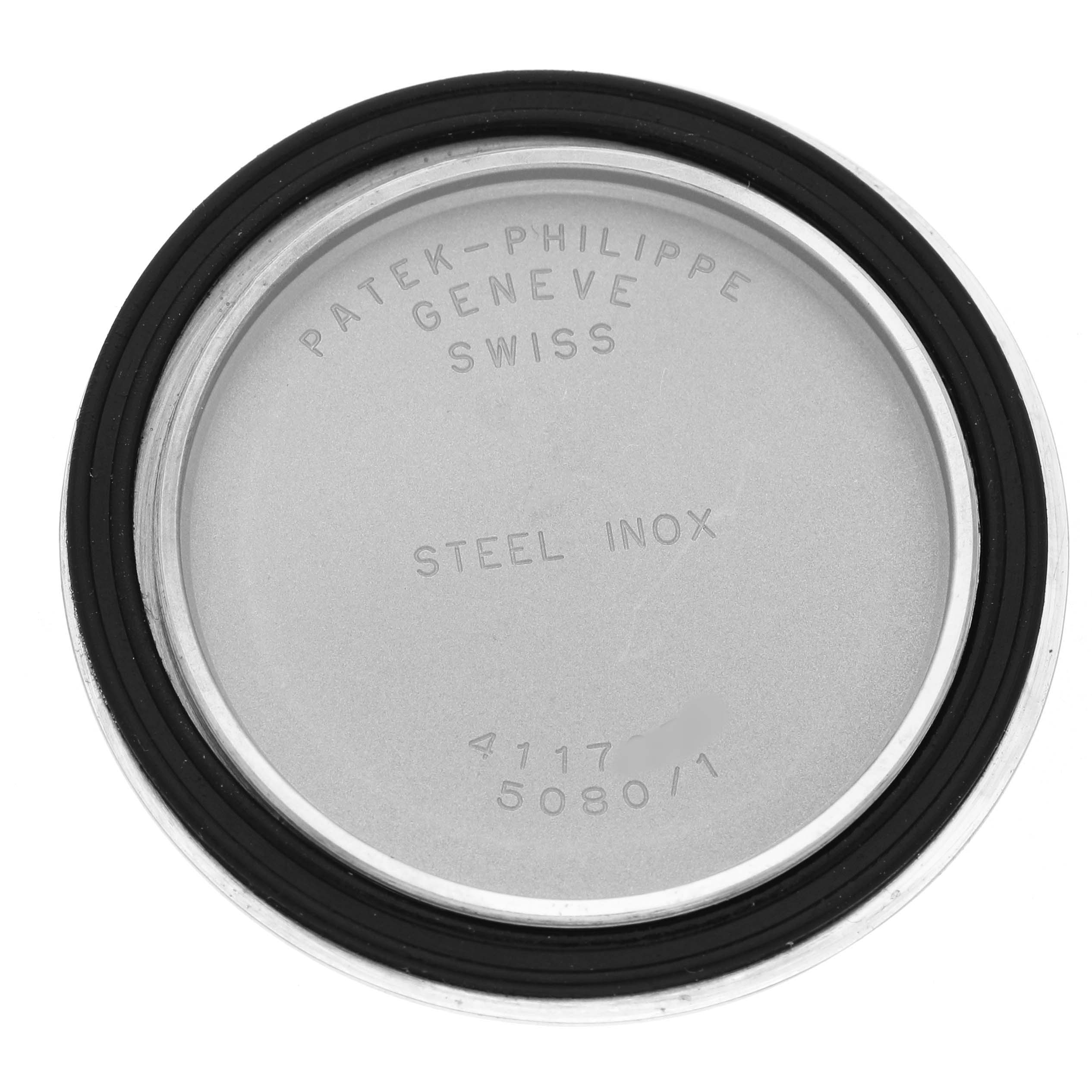 The image shows the back cover of a Patek Philippe Neptune 5080A Men's Stainless Steel Silver Dial watch, featuring engraved text and a rubber gasket.