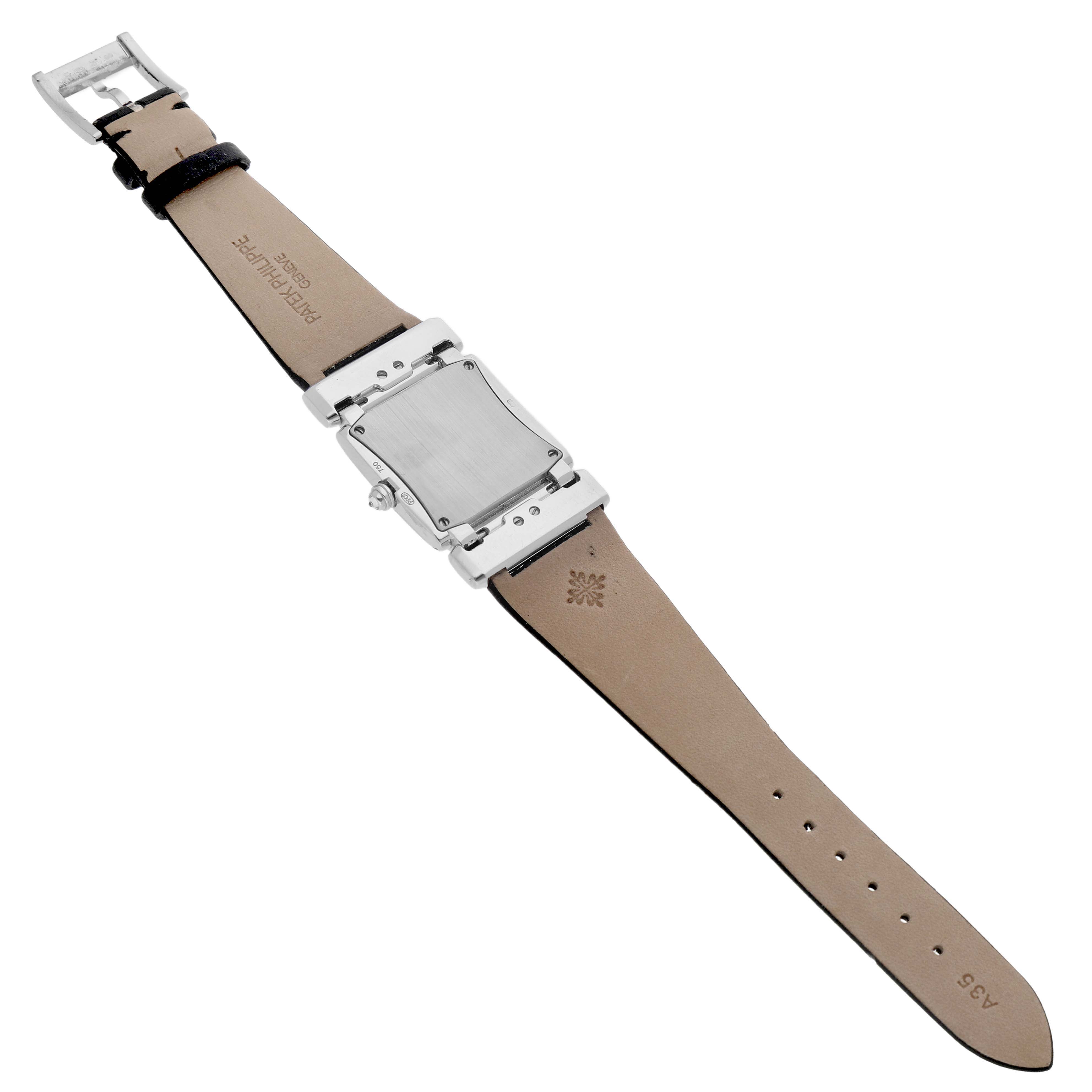 The Patek Philippe Twenty-4 4920G Women's White Gold Silver Dial watch is shown from the back, displaying its case and leather strap.