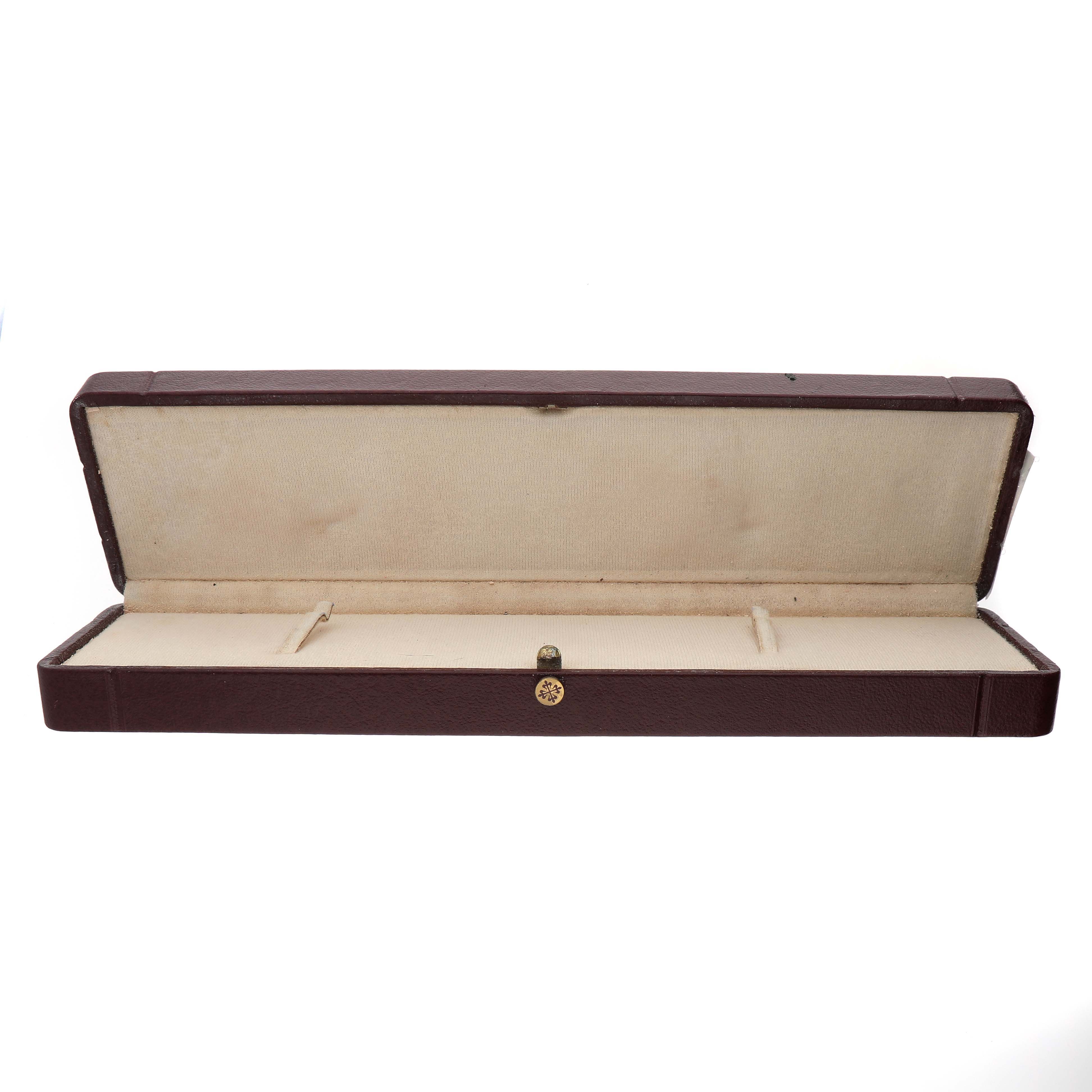 The image shows an open box for a Patek Philippe Twenty-4 4920G Women's White Gold Silver Dial watch, featuring a beige interior and a hinged lid.