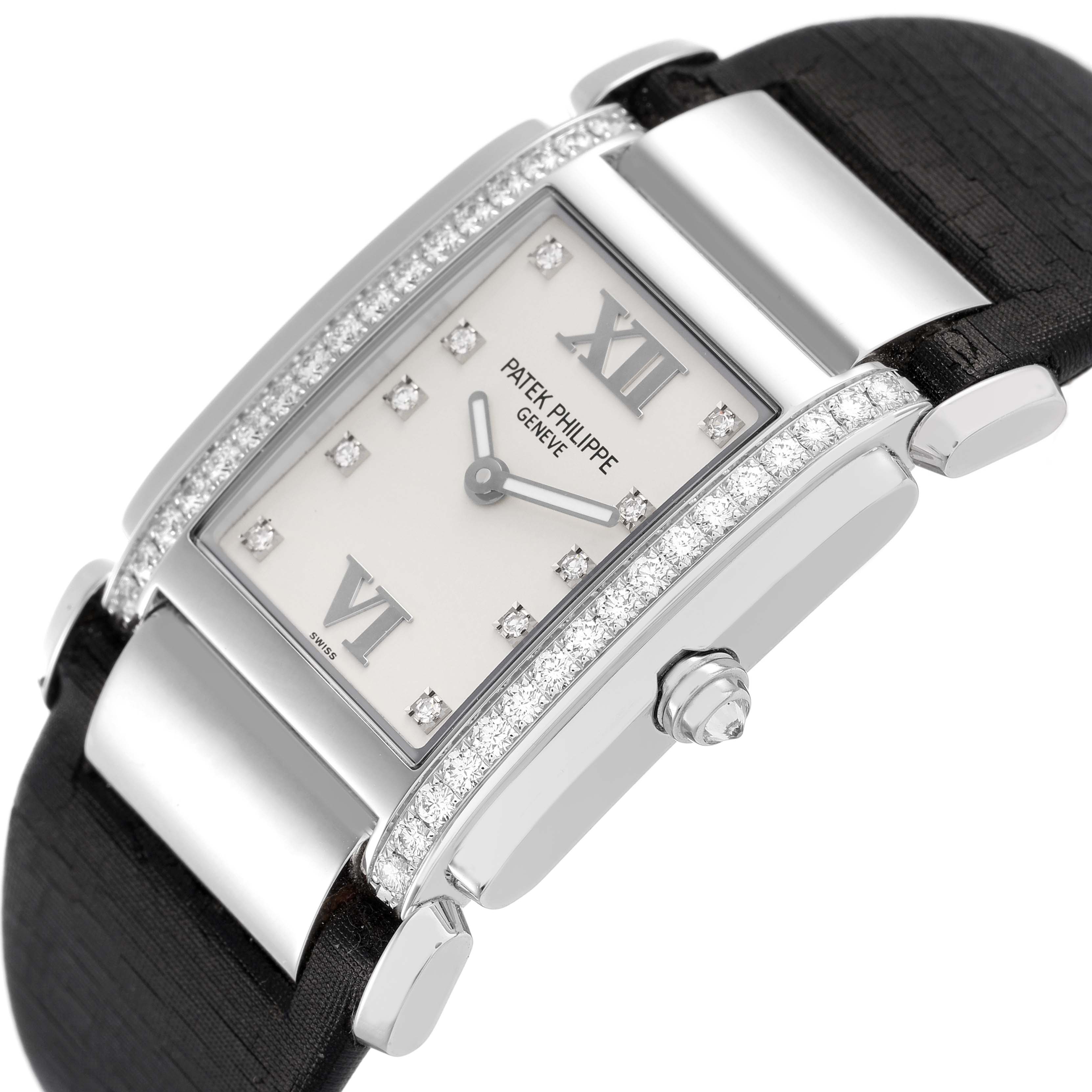 The Patek Philippe Twenty-4 4920G Women's White Gold Silver Dial watch is shown at an angle highlighting the face, crown, strap, and diamond-accented bezel.